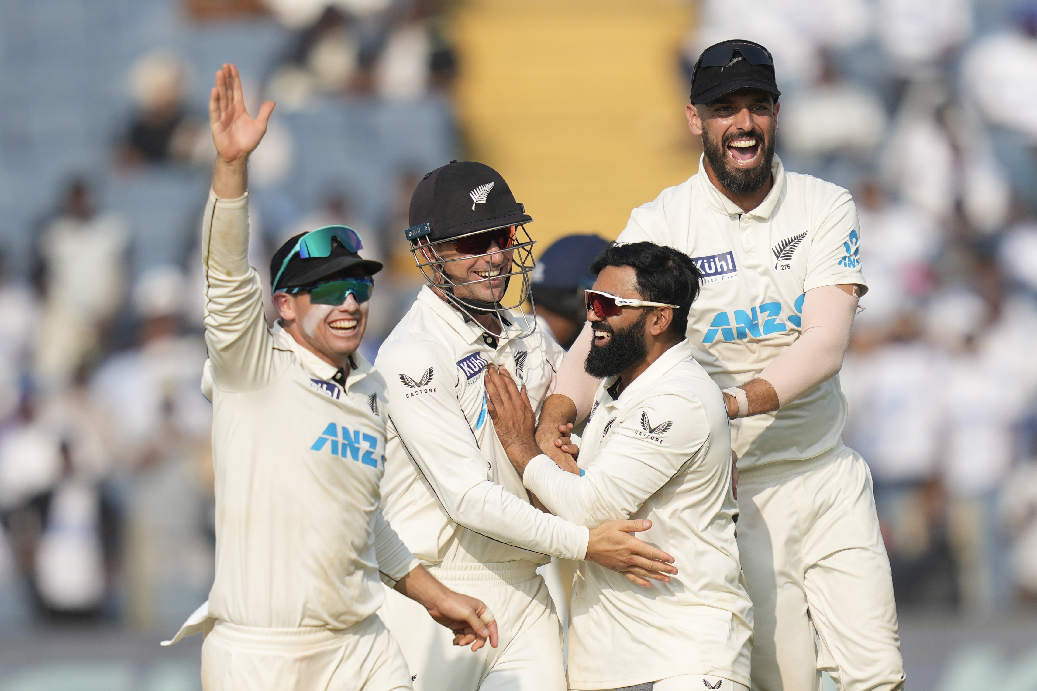 New Zealand's captain Tom Latham, left, along with his team mates celebrate after their win against India on the day three of the second cricket test match at the Maharashtra Cricket Association Stadium , in Pune, India, Saturday, Oct. 26, 2024. (AP Photo/Rafiq Maqbool)