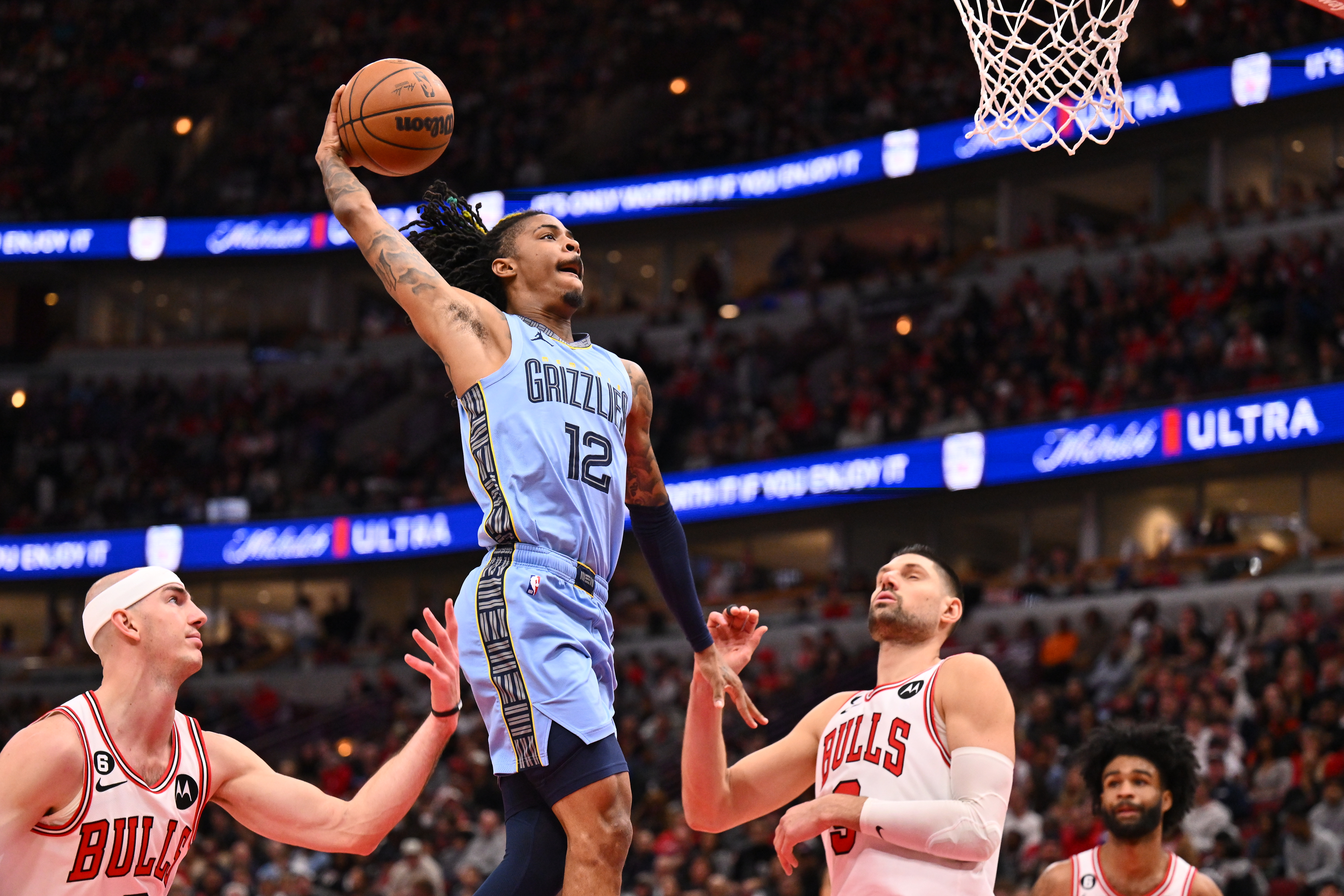 Ja Morant #12 of the Memphis Grizzlies soars in for a dunk against the Chicago Bulls on April 2, 2023 at the United Center in Chicago, Illinois