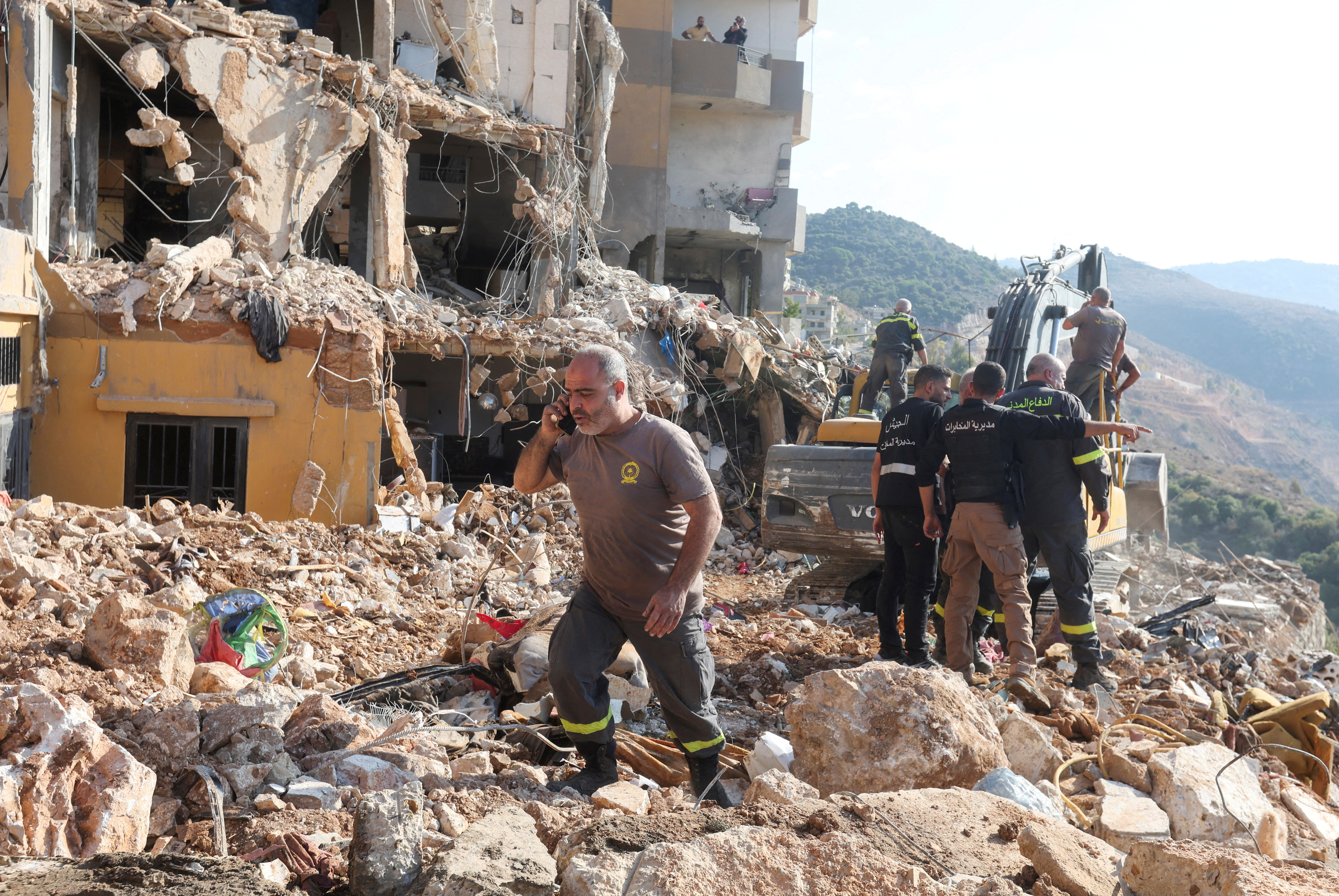 Civil defense members work at a site damaged in the aftermath of an Israeli strike, amid the ongoing hostilities between Hezbollah and Israeli forces, in Barja, Lebanon November 6, 2024. REUTERS/Aziz Taher TPX IMAGES OF THE DAY
