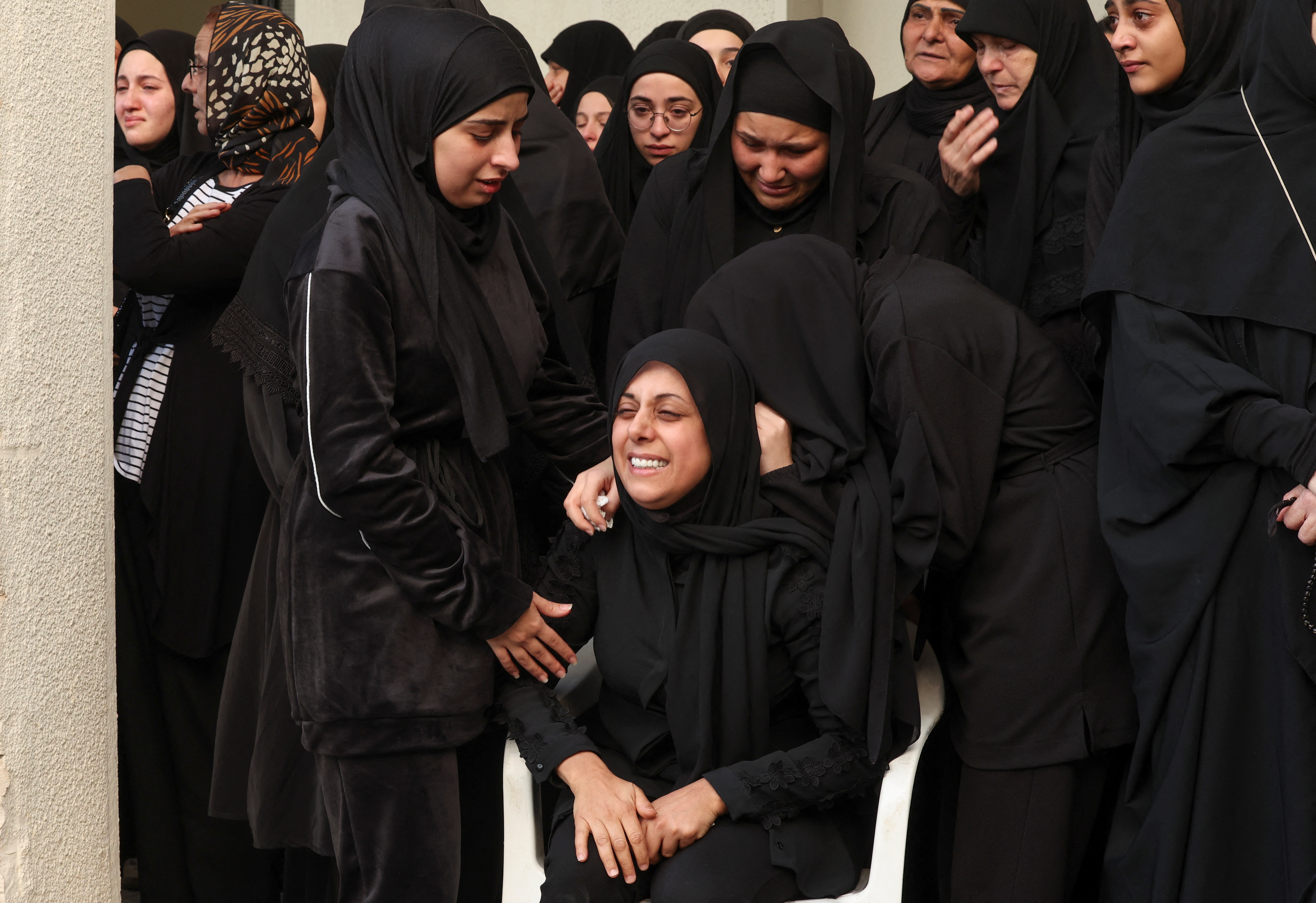 A mourner reacts during the funeral of her relative who was killed in Israeli strikes, amid the continuing hostilities between Hezbollah and Israeli forces, in Joun village in the Chouf district, Lebanon