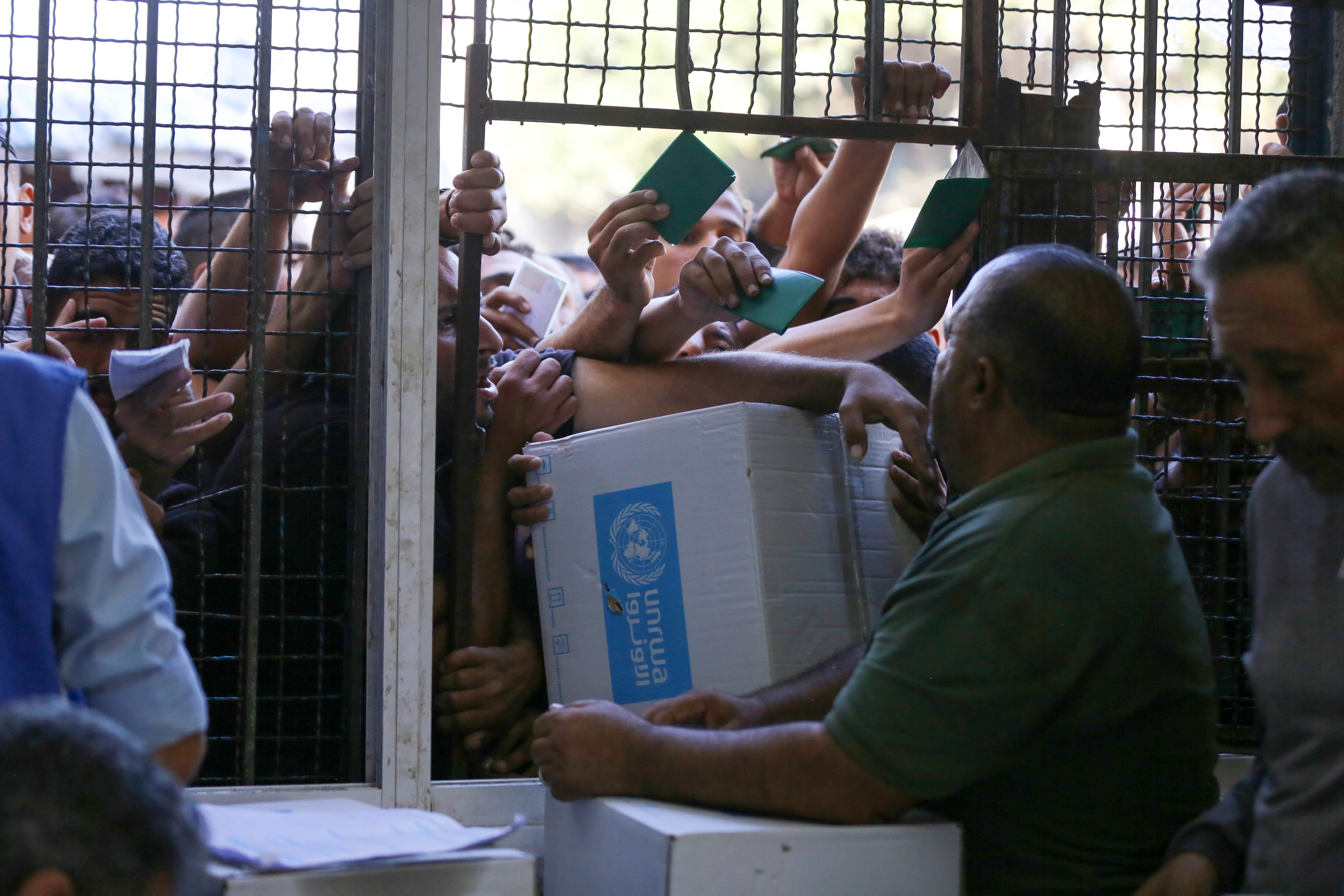 UNRWA distributes aid parcels to Palestinians in Gaza amid food crisis