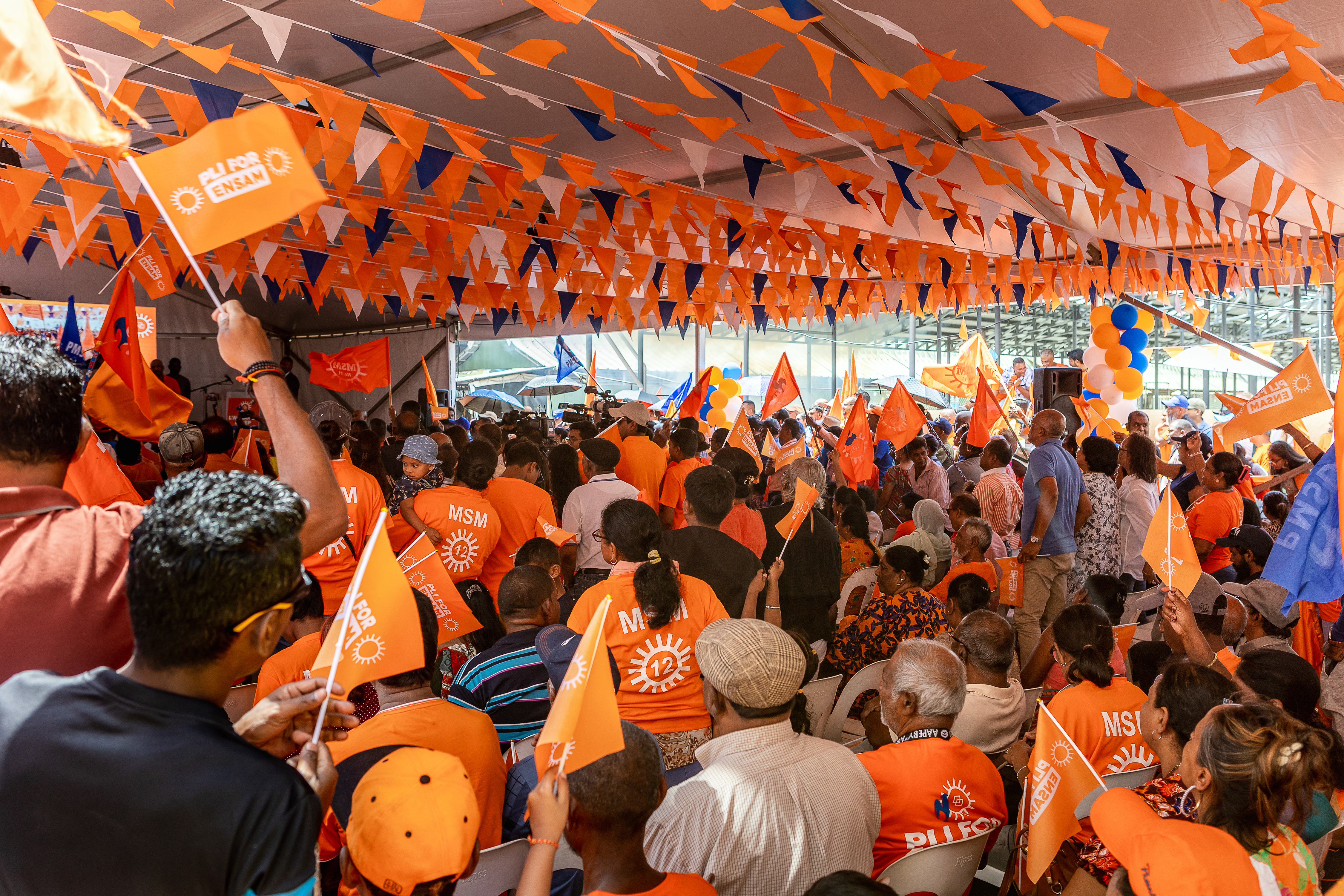 Supporters of the Militant Socialist Movement (MSM) party attend a campaign rally led by Prime Minister of Mauritius and candidate Pravind Jugnauth in Mahebourg on October 20, 2024, ahead of the 2024 Mauritian general election