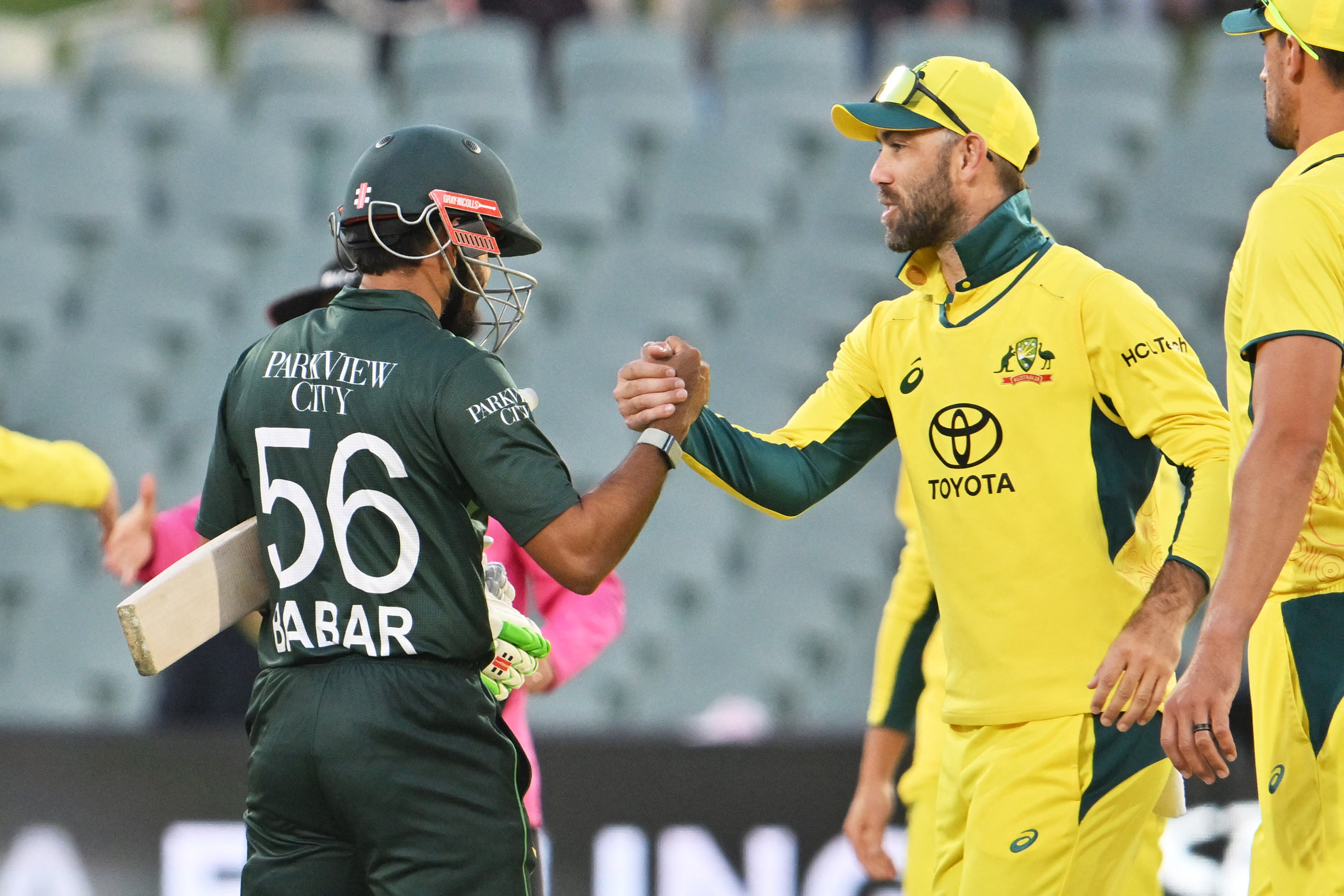 Australia's Glenn Maxwell (R) congratulates Pakistan's Babar Azam after their victory during the one-day international cricket match between Australia and Pakistan at Adelaide Oval in Adelaide on November 8, 2024. (Photo by Brenton EDWARDS / AFP) / -- IMAGE RESTRICTED TO EDITORIAL USE - STRICTLY NO COMMERCIAL USE --