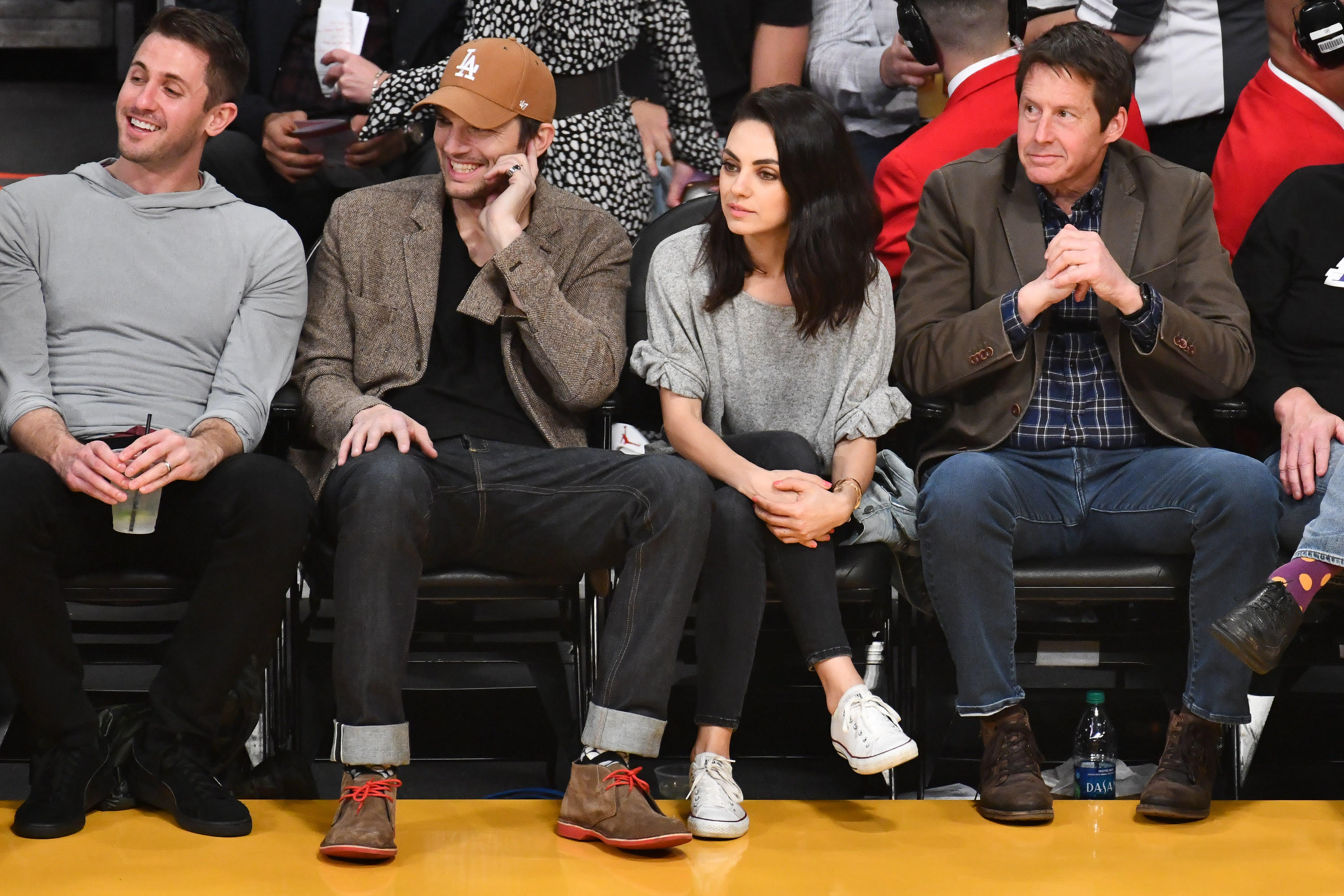 Ashton Kutcher wears Veldskoen shoes to a basketball game.