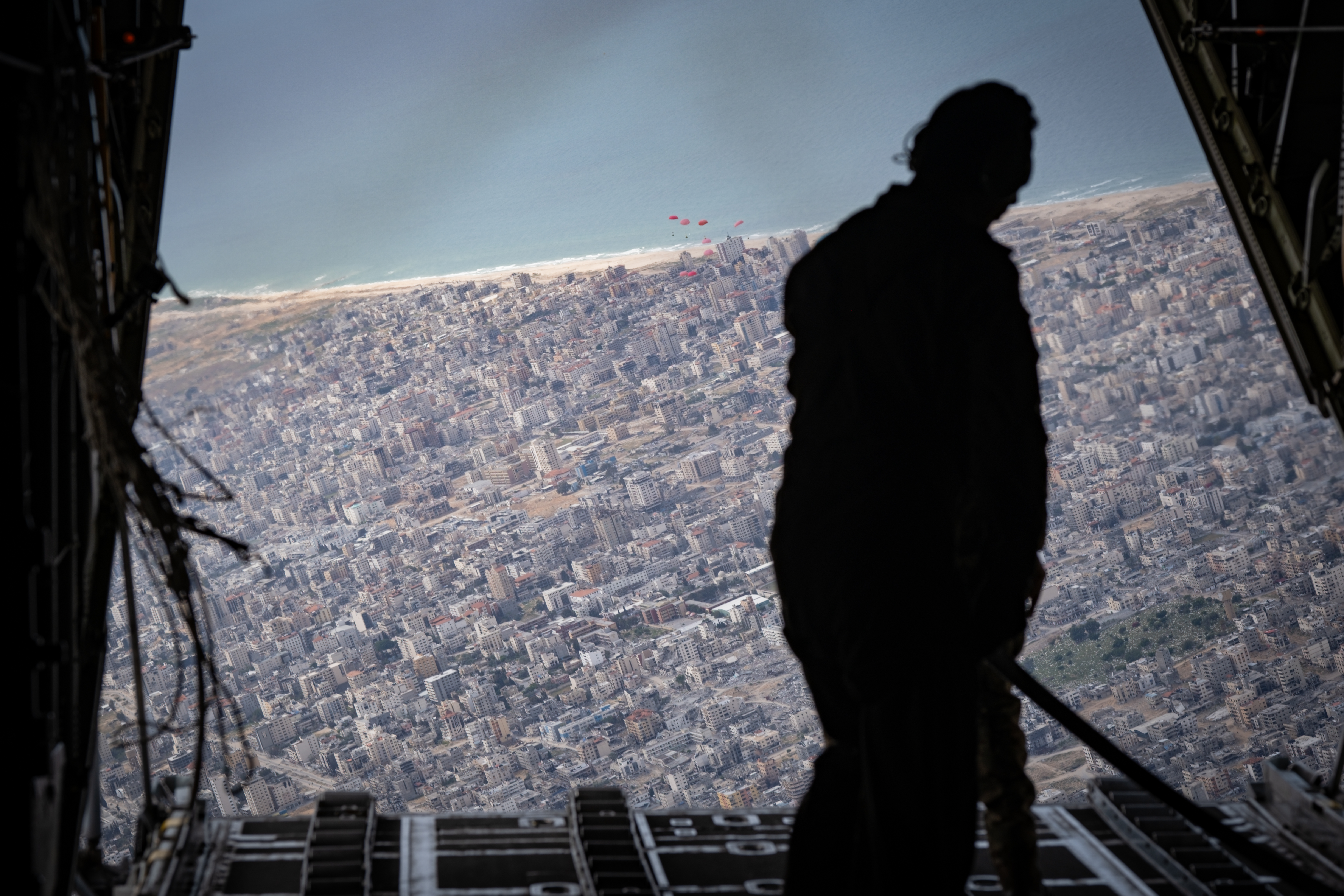 The view from a humanitarian airdrop over Gaza City by the Royal Jordanian Air Force in March 2024. The flight was guided over the outskirts of Tel Aviv and along Israel’s coast by Israeli air traffic control