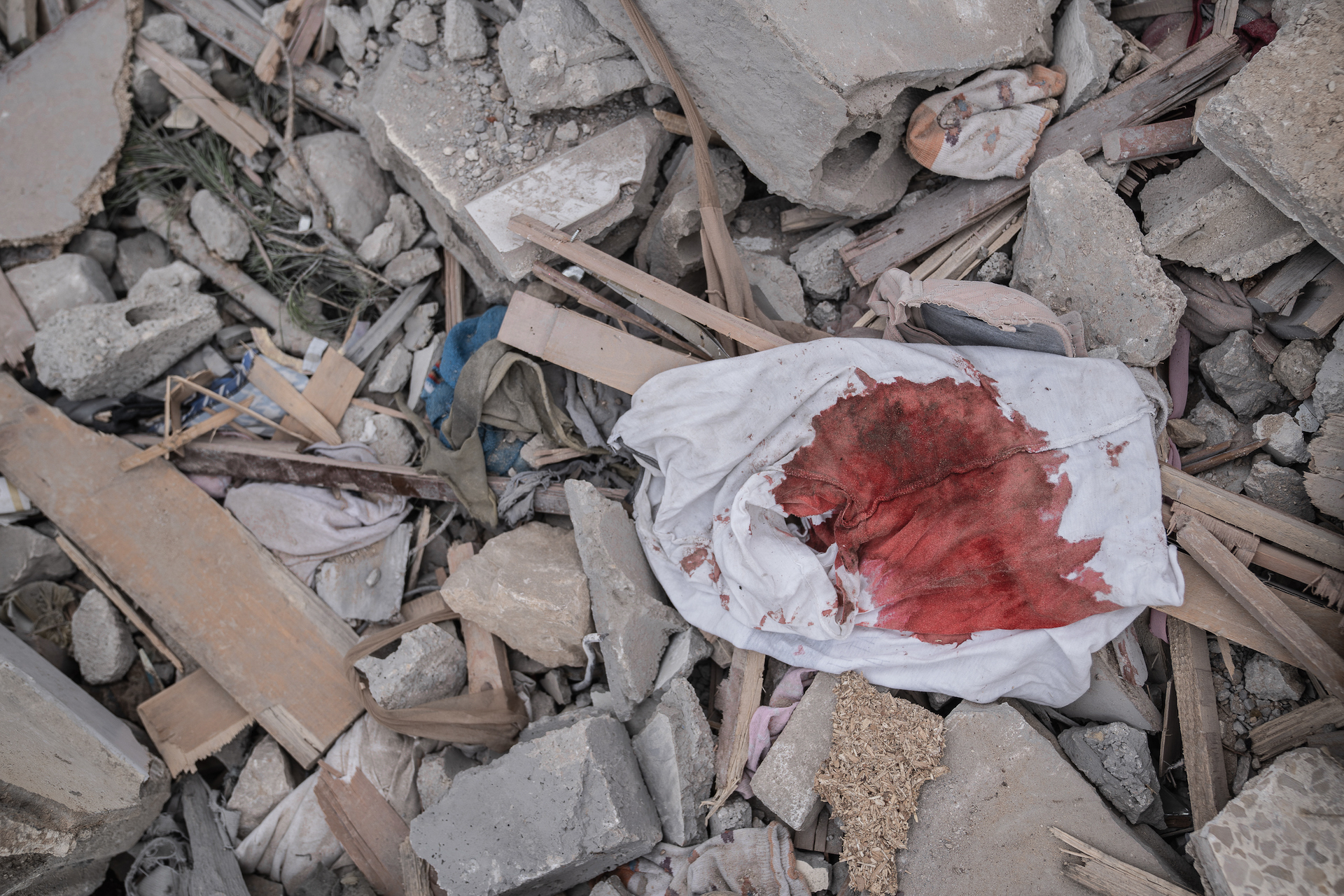 A bloodied shirt lies in the rubble in the aftermath of the Israeli bombing in Ain Yaaqoub