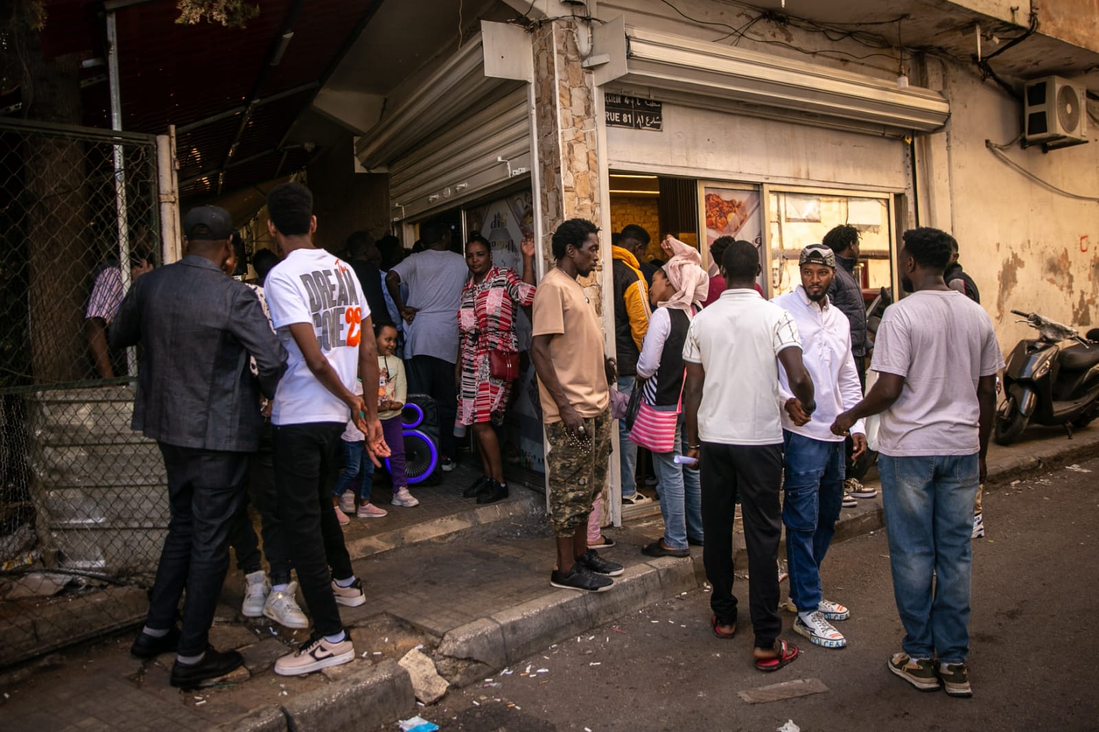 Sudanese asylum seekers gather to listen to Abdel Baki speak in Beirut, Lebanon