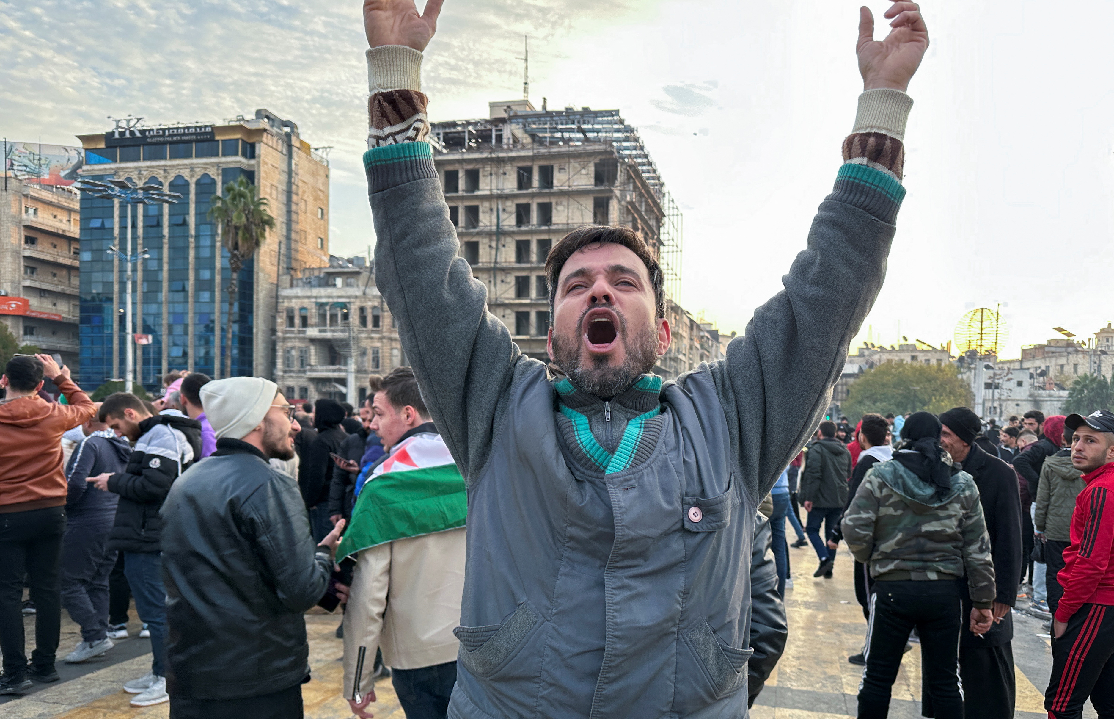 People gather at Saadallah al-Jabiri Square in Aleppo