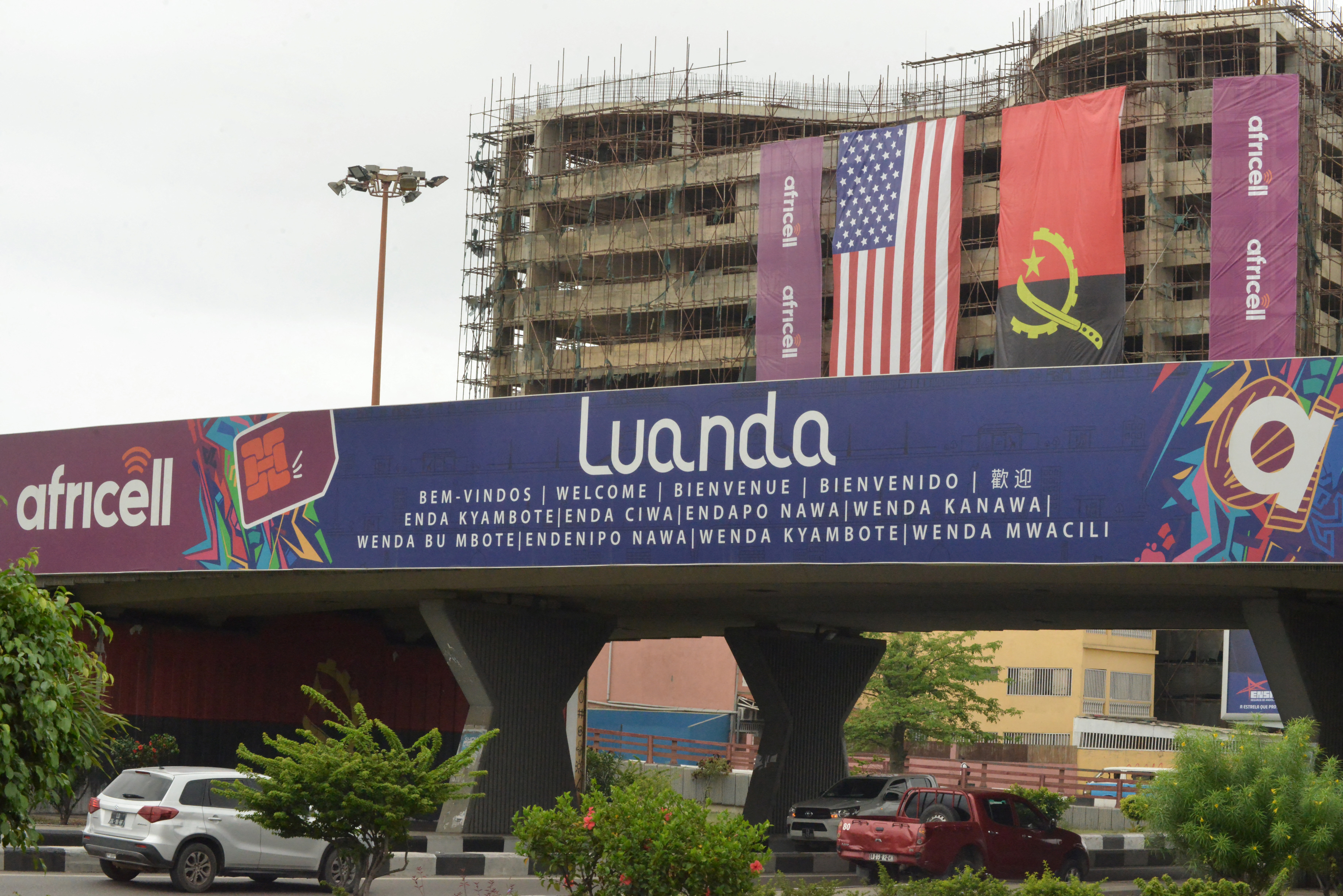 The Angolan and US flag hang from a building near the Quatro de Fevereiro Luanda International Airport on December 2, 2024 before the visit by US President Joe Biden to Angola