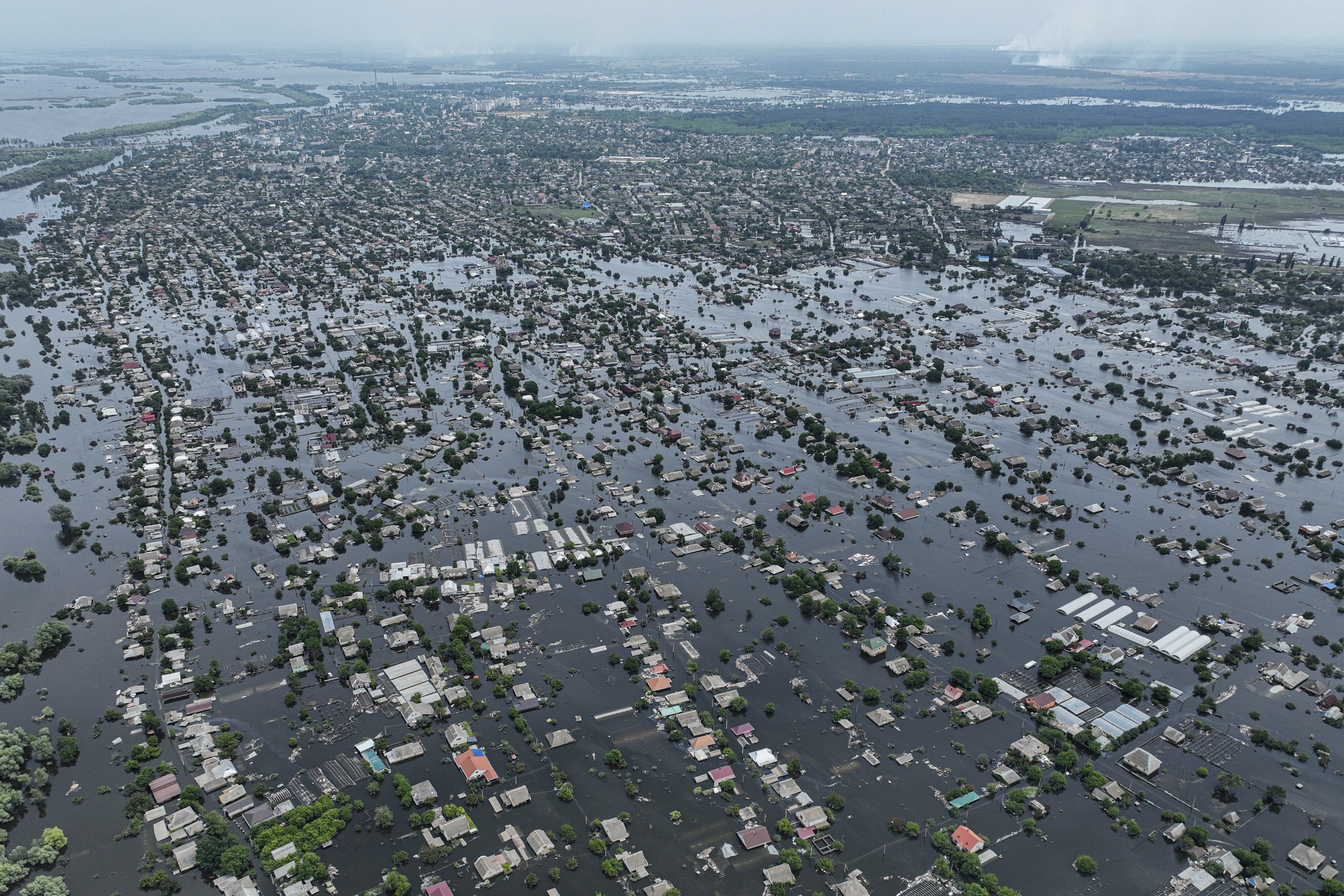 Houses are seen underwater in the flooded town of Oleshky, Ukraine, on Saturday, June 10, 2023. A catastrophic dam collapse in the southern Kherson region altered the geography along the Dnipro River
