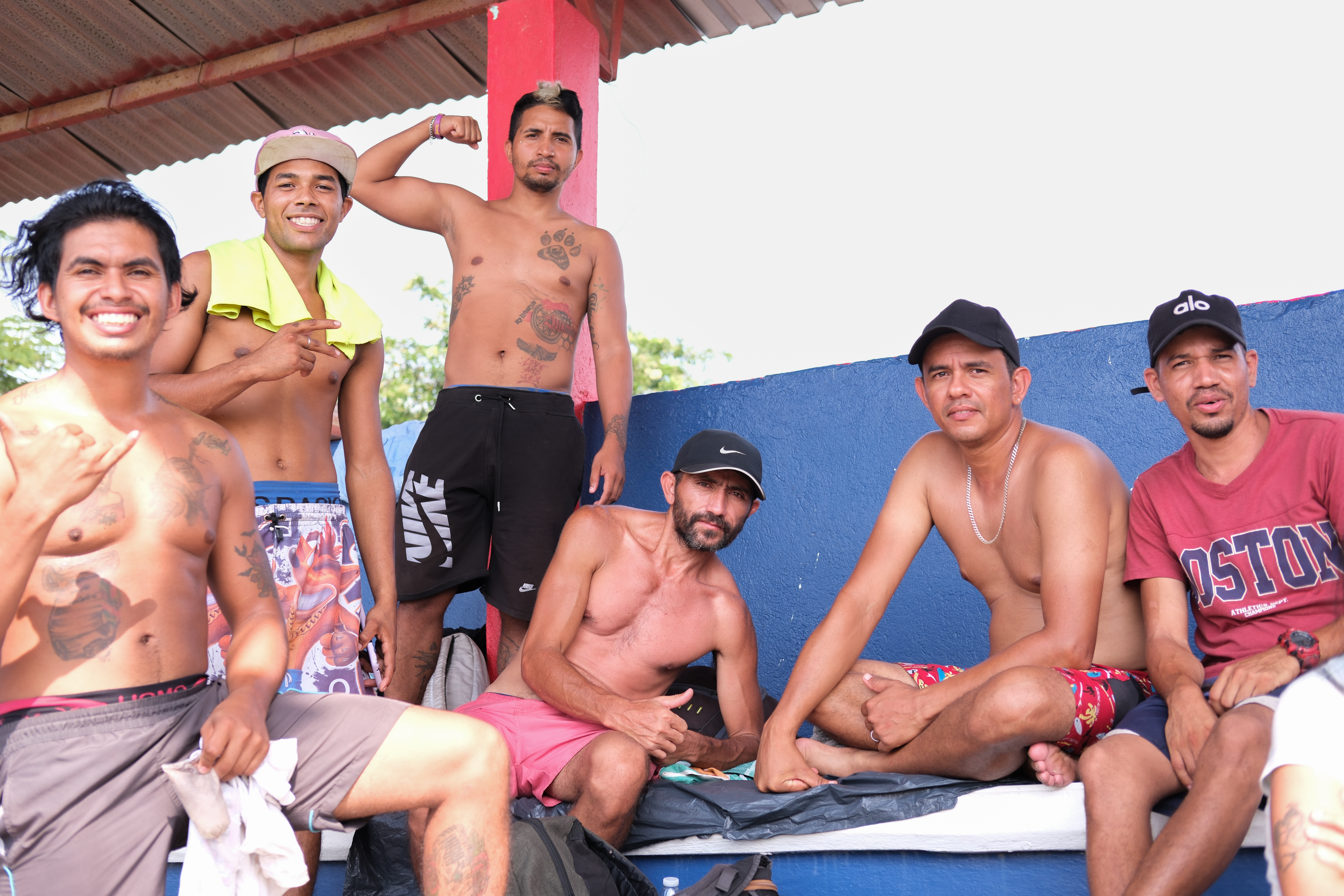 Migrants and asylum seekers pose for a photo in Santiago Niltepec, Mexico