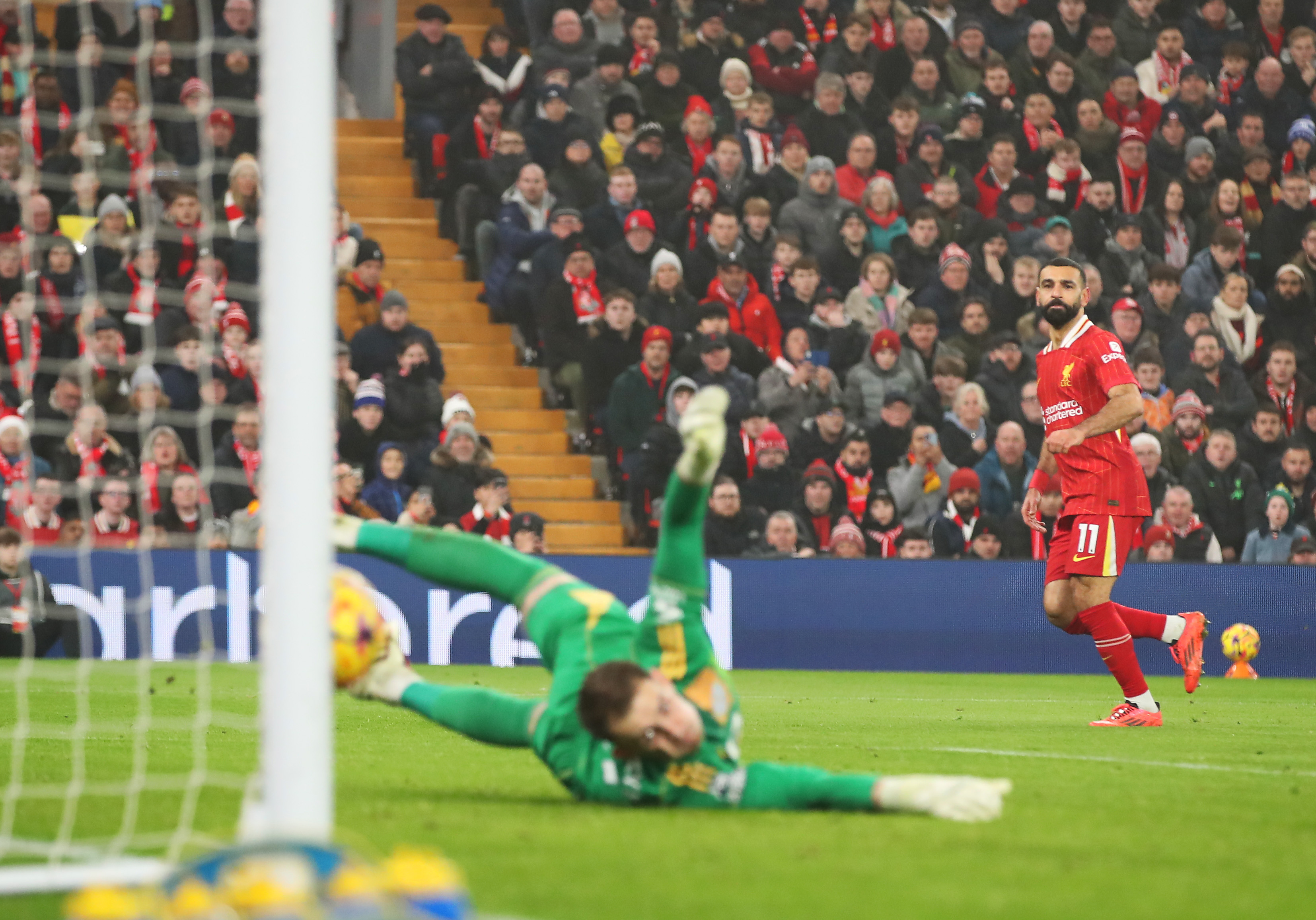 Mohamed Salah of Liverpool scores his team’s third goal – and the 100th of his Premier League career – during the Premier League match between Liverpool FC and Leicester City FC at Anfield on December 26, 2024 in Liverpool, England