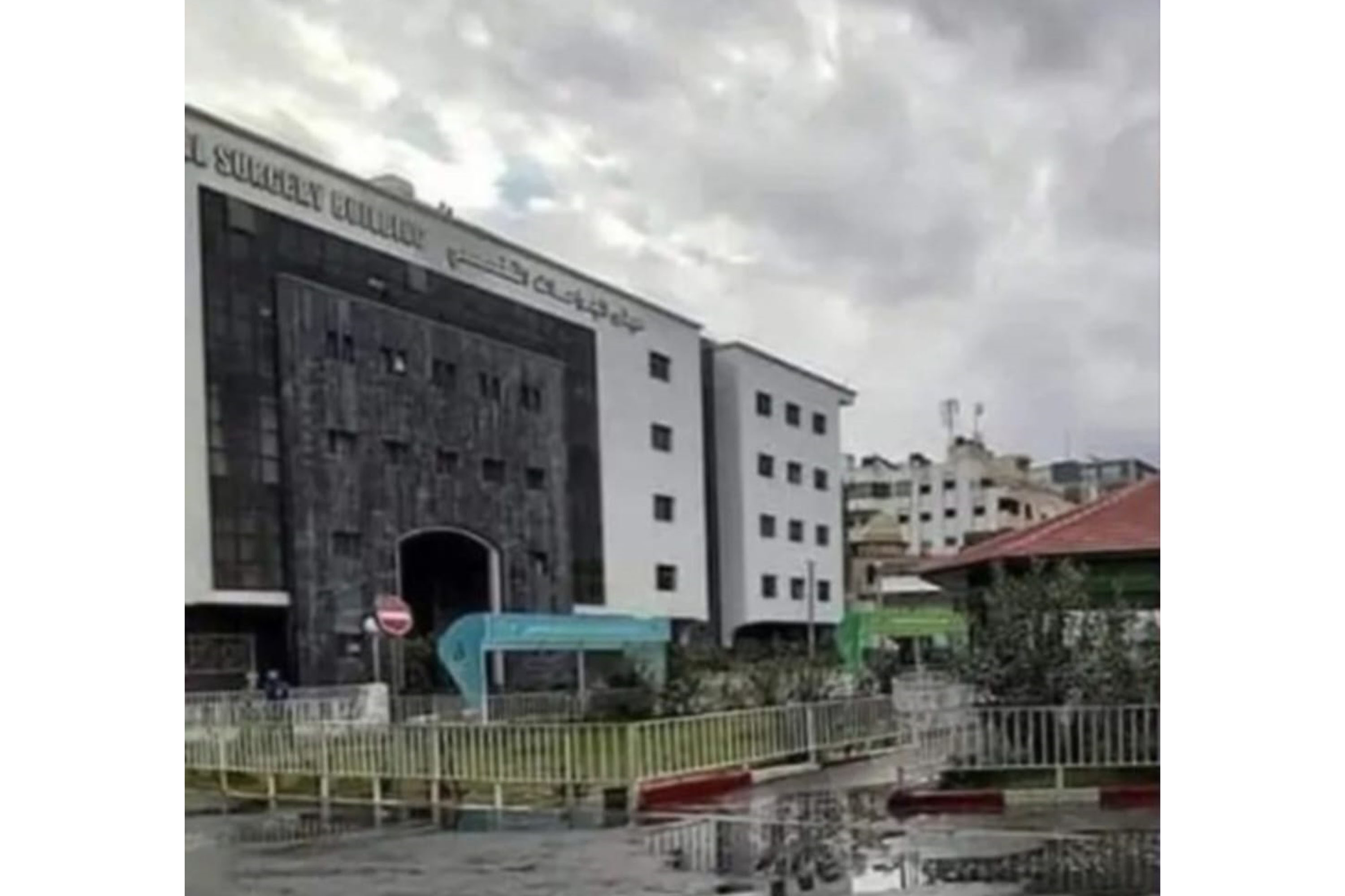 a photo of a hospital building on a rainy day