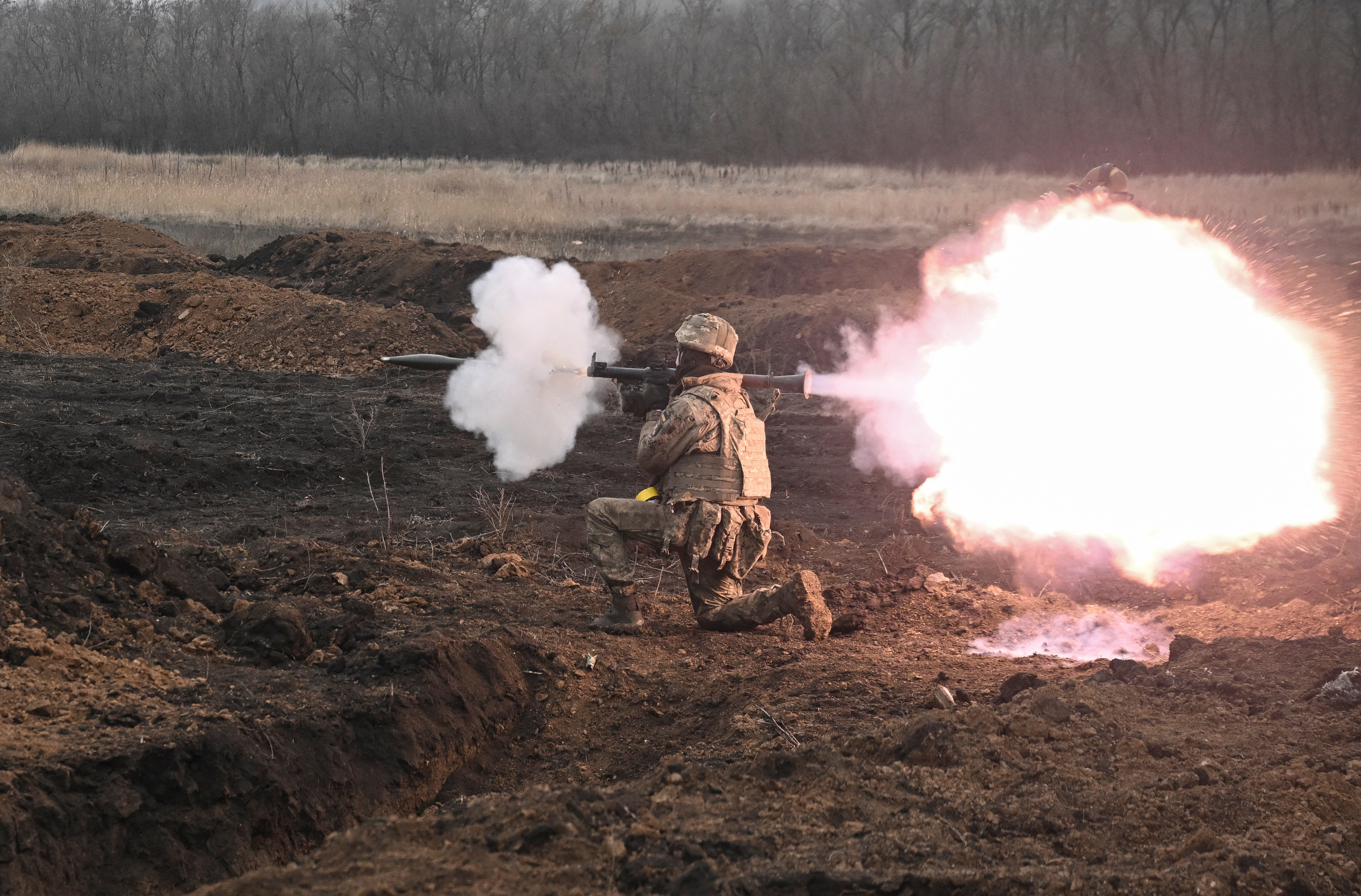 A serviceman of 110th Brigade of the Territorial Defence Forces of Ukraine fires a RPG-7 grenade launcher during a training, amid Russia's attack on Ukraine, in Zaporizhzhia region, Ukraine January 26, 2025. REUTERS/Stringer