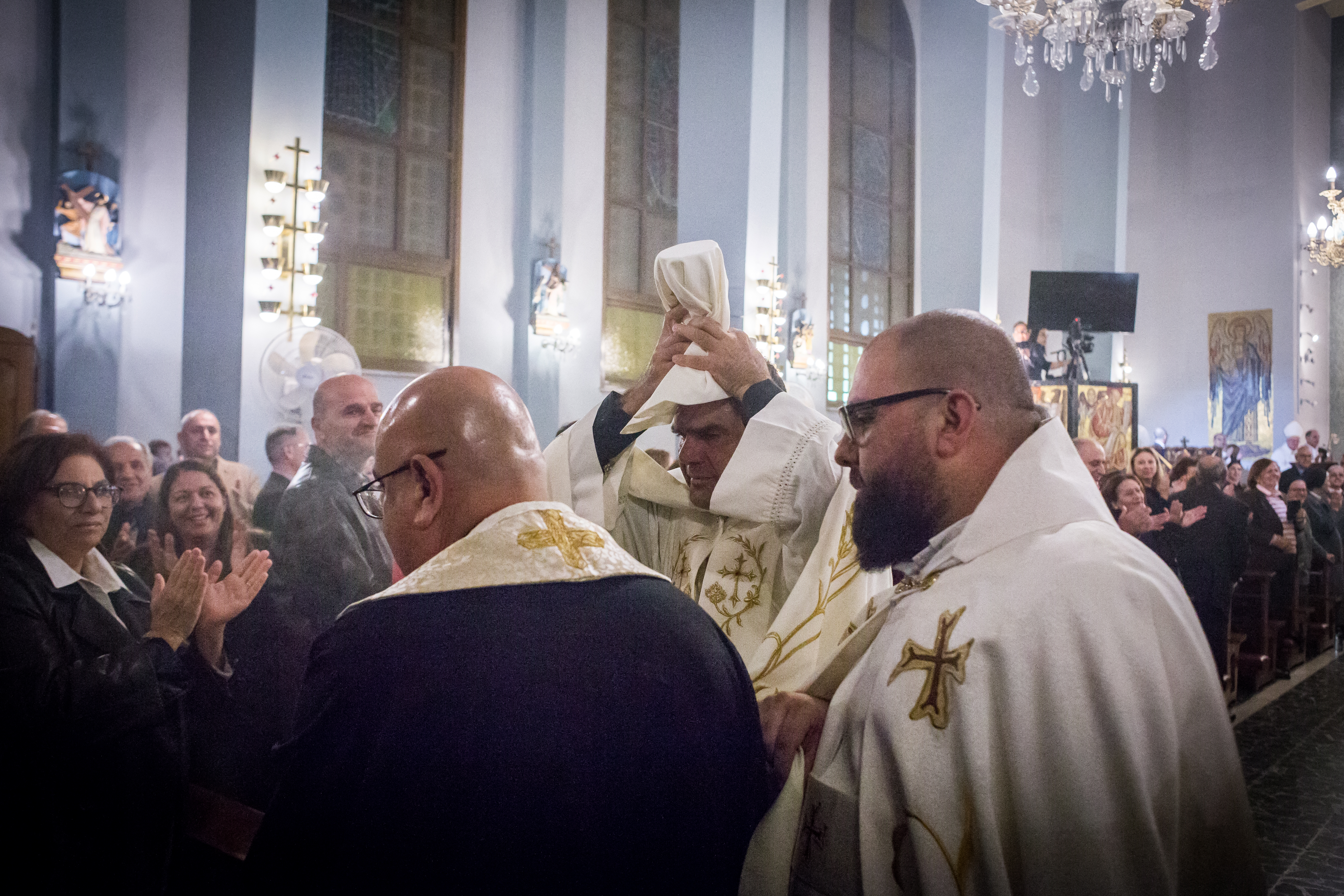 Celebrations in a cathedral for the appointment of the first Cypriot Maronite priest.