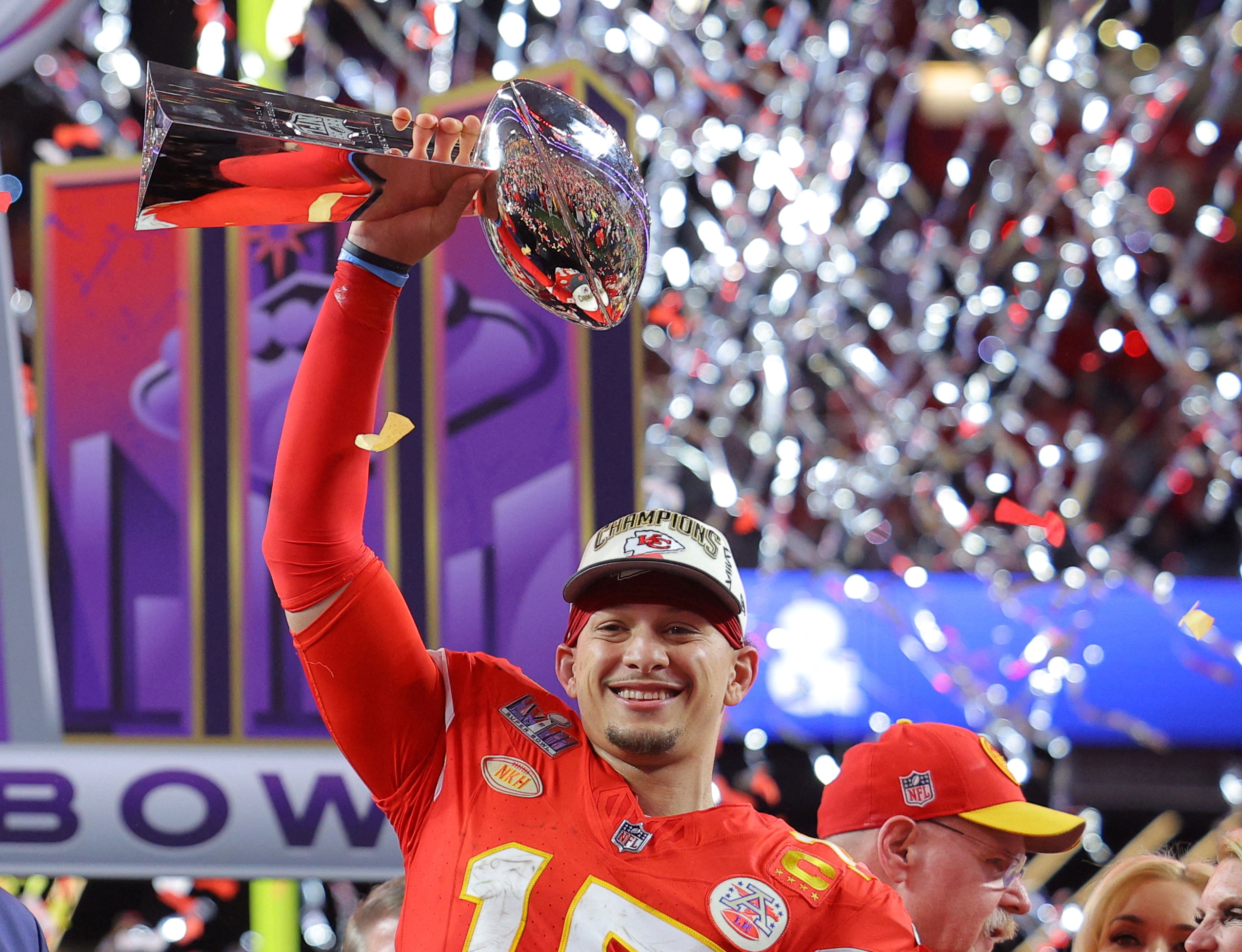 Kansas City Chiefs quarterback Patrick Mahomes celebrates with the Vince Lombardi Trophy after winning Super Bowl LVIII in 2024