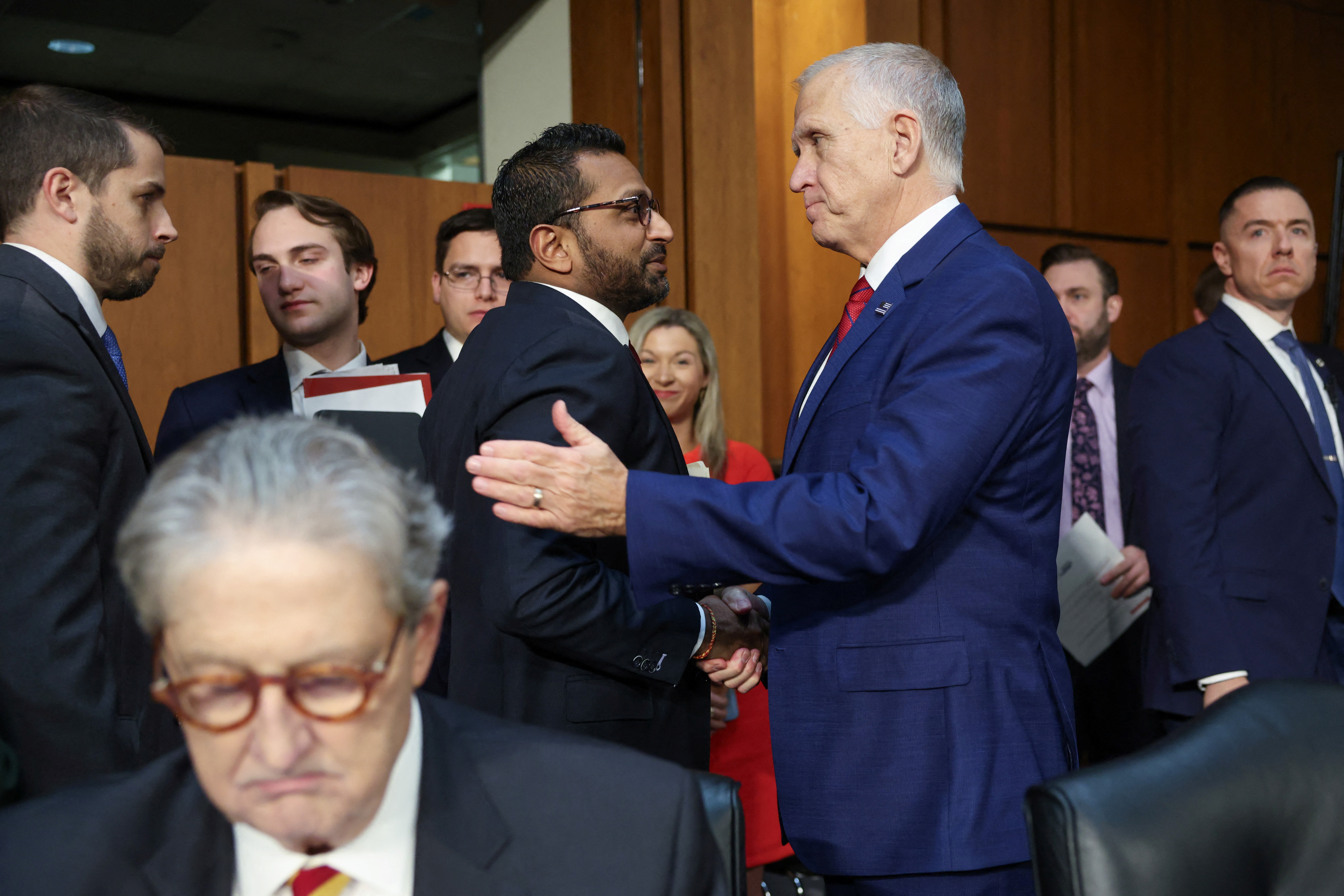 Senator Thom Tillis shakes hands with Kash Patel after a confirmation hearing on January 30