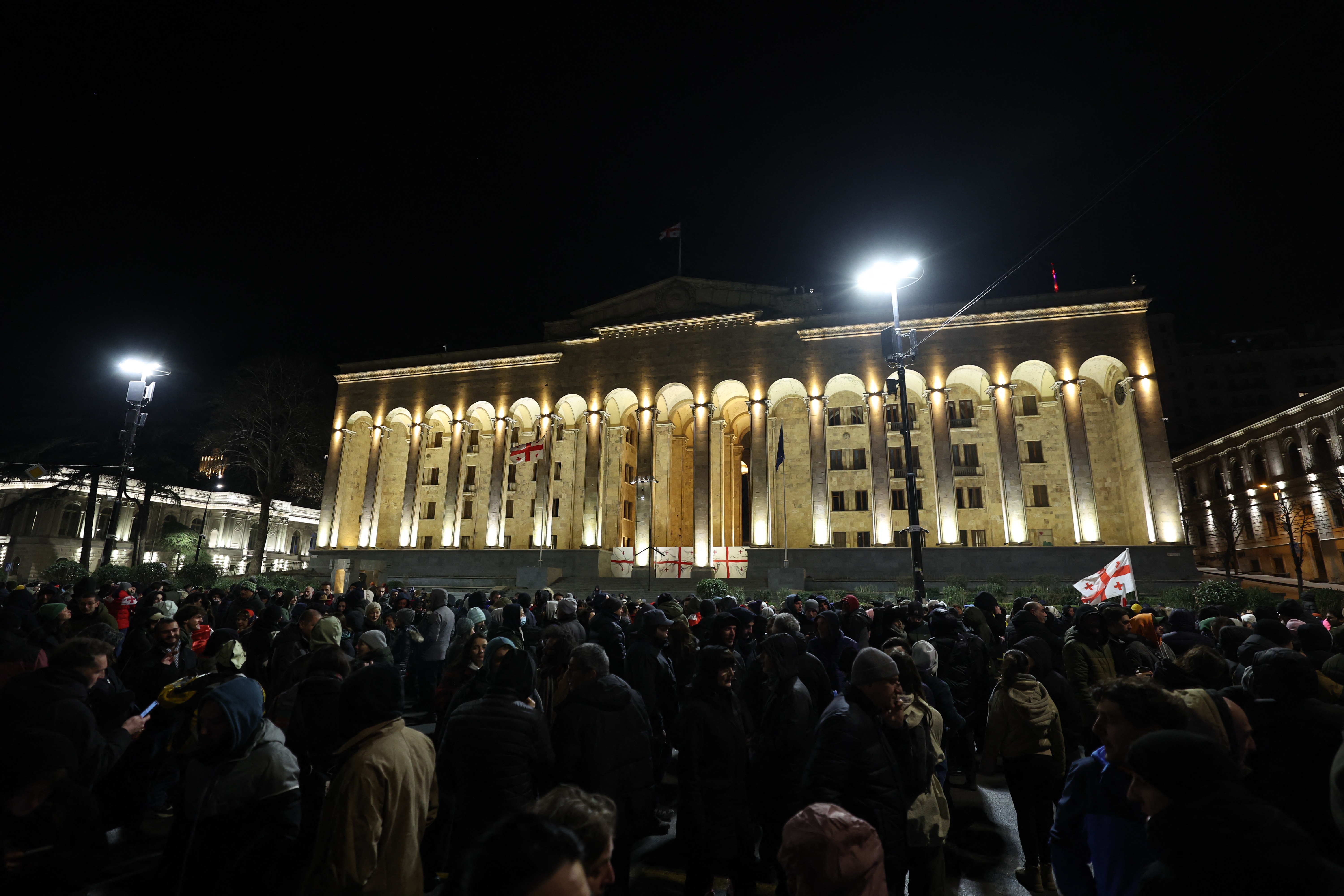 Georgian anti-government demonstrators rally outside the parliament.