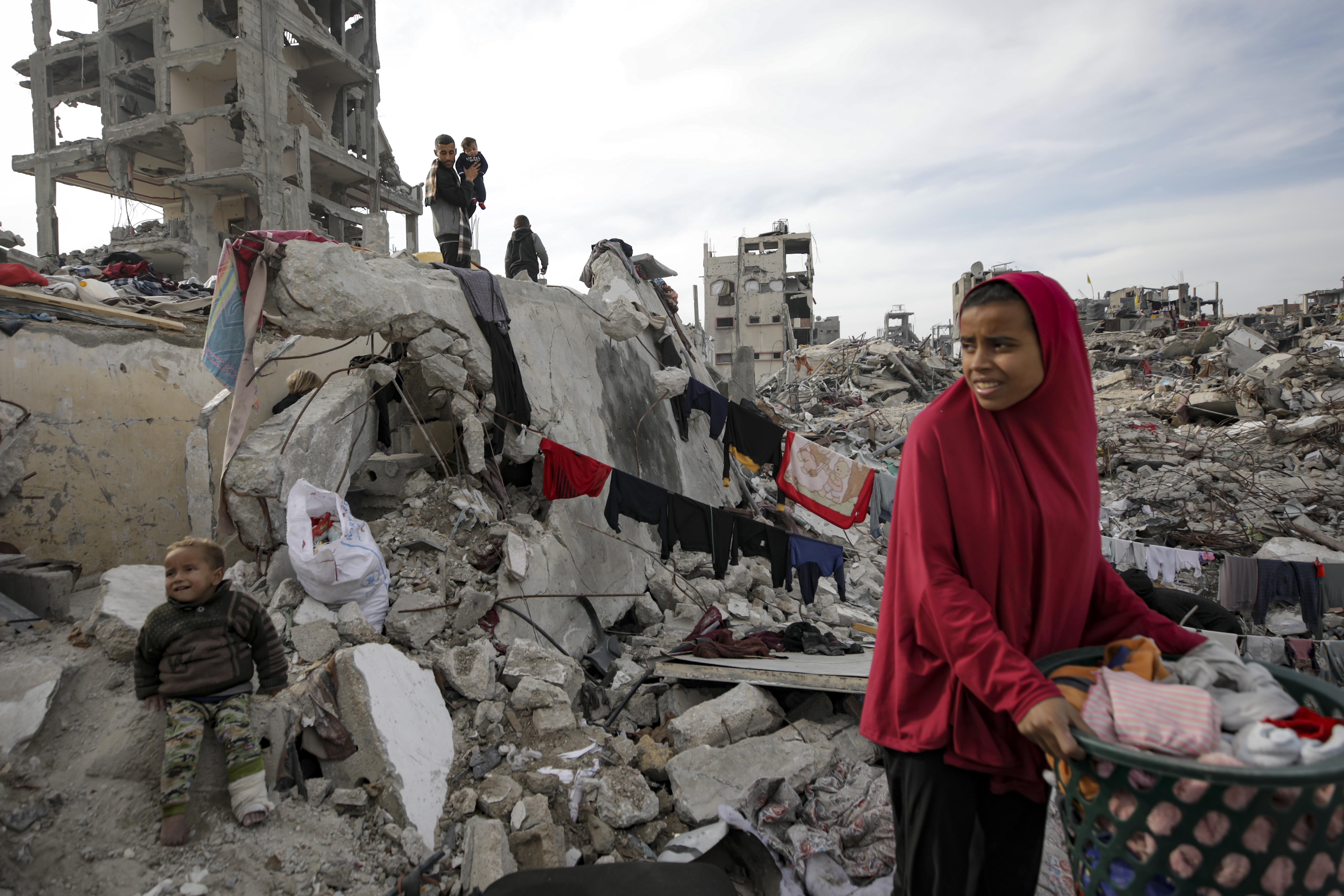 The Nijim family hang laundry on the ruins of their house, amid widespread destruction caused by Israel, in Jabaliya on February 18, 2025