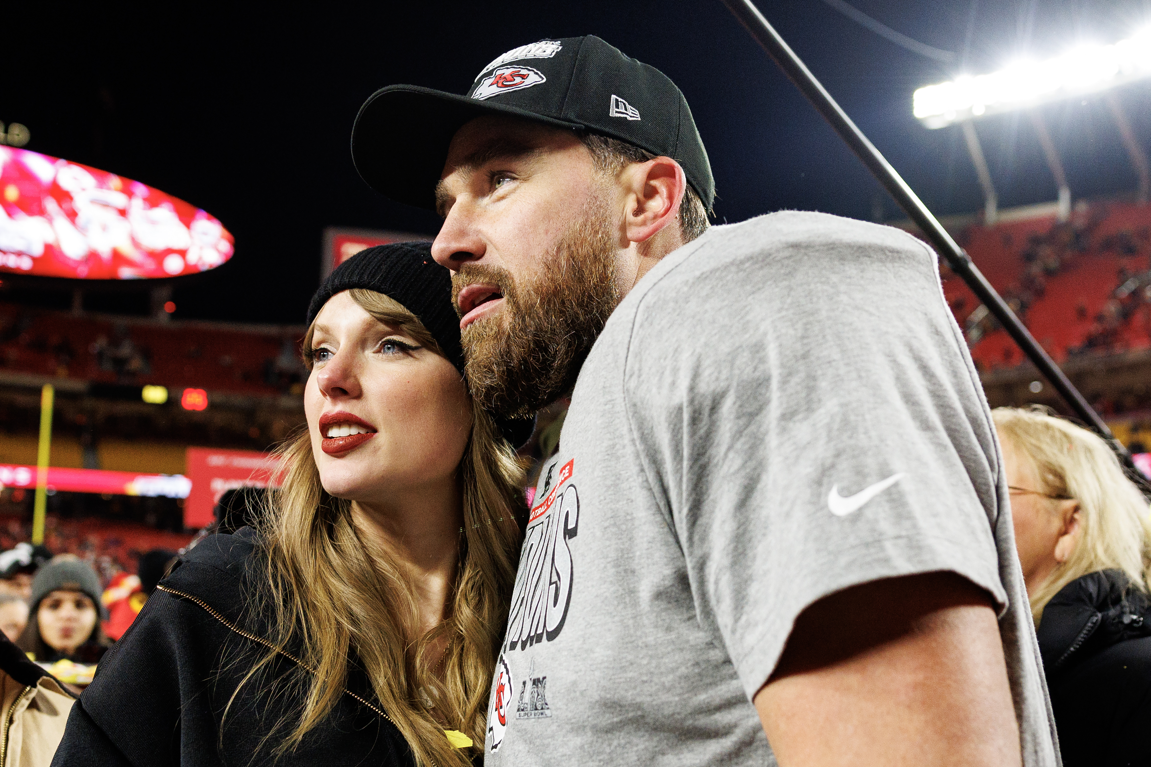 Tight end Travis Kelce of the Kansas City Chiefs celebrates with girlfriend Taylor Swift after winning the AFC Championship Game against the Buffalo Bills on January 26, 2025, at Arrowhead Stadium in Kansas City, Missouri