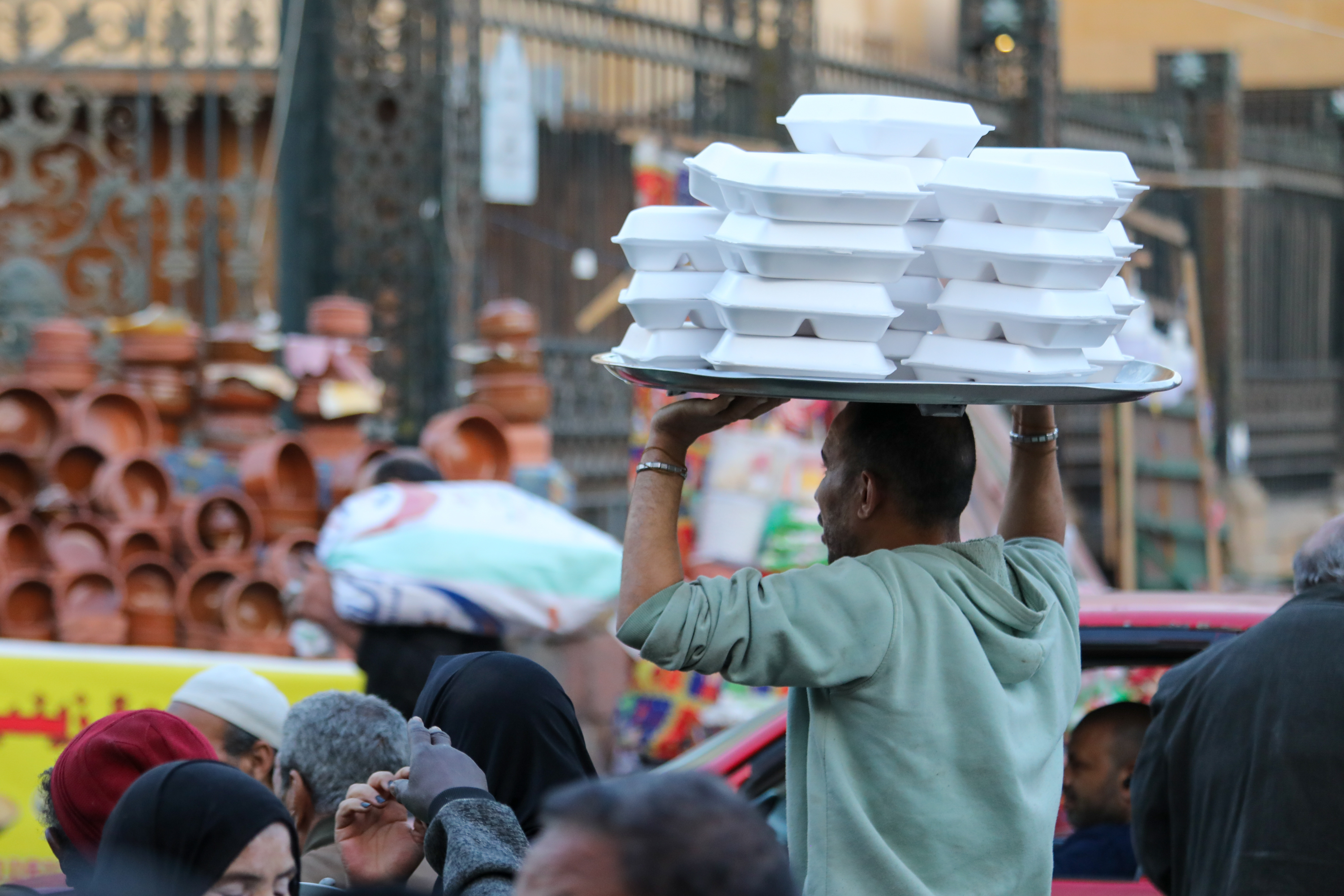 The volunteers are the last to eat, making sure that everyone else gets their meal first [Al Jazeera]