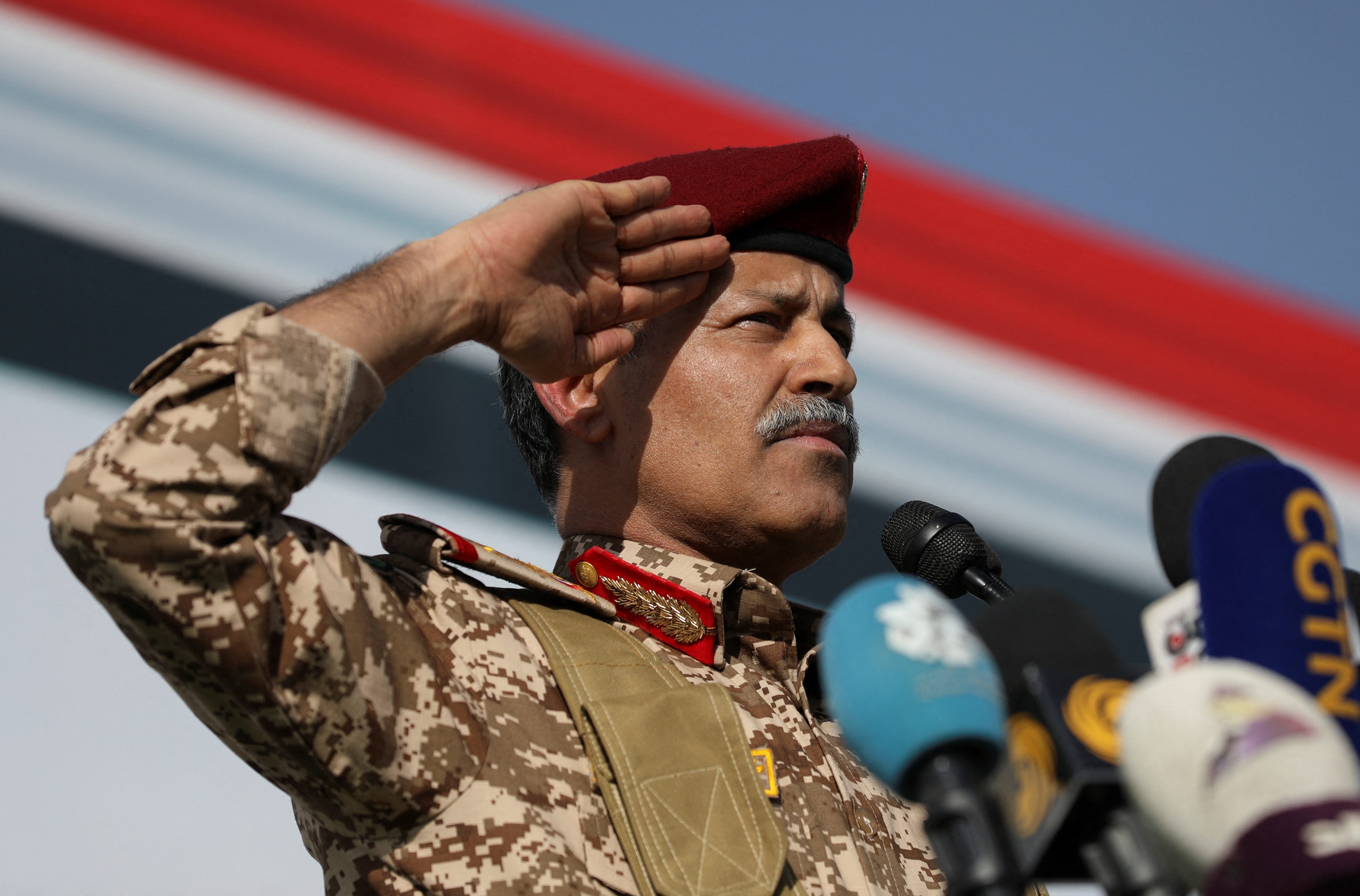 Houthi Defence Minister Muhammad al-Atefi salutes after addressing protesters demonstrating in solidarity with the Palestinians in the Gaza Strip, in Sanaa, Yemen February 14, 2025. REUTERS/Khaled Abdullah