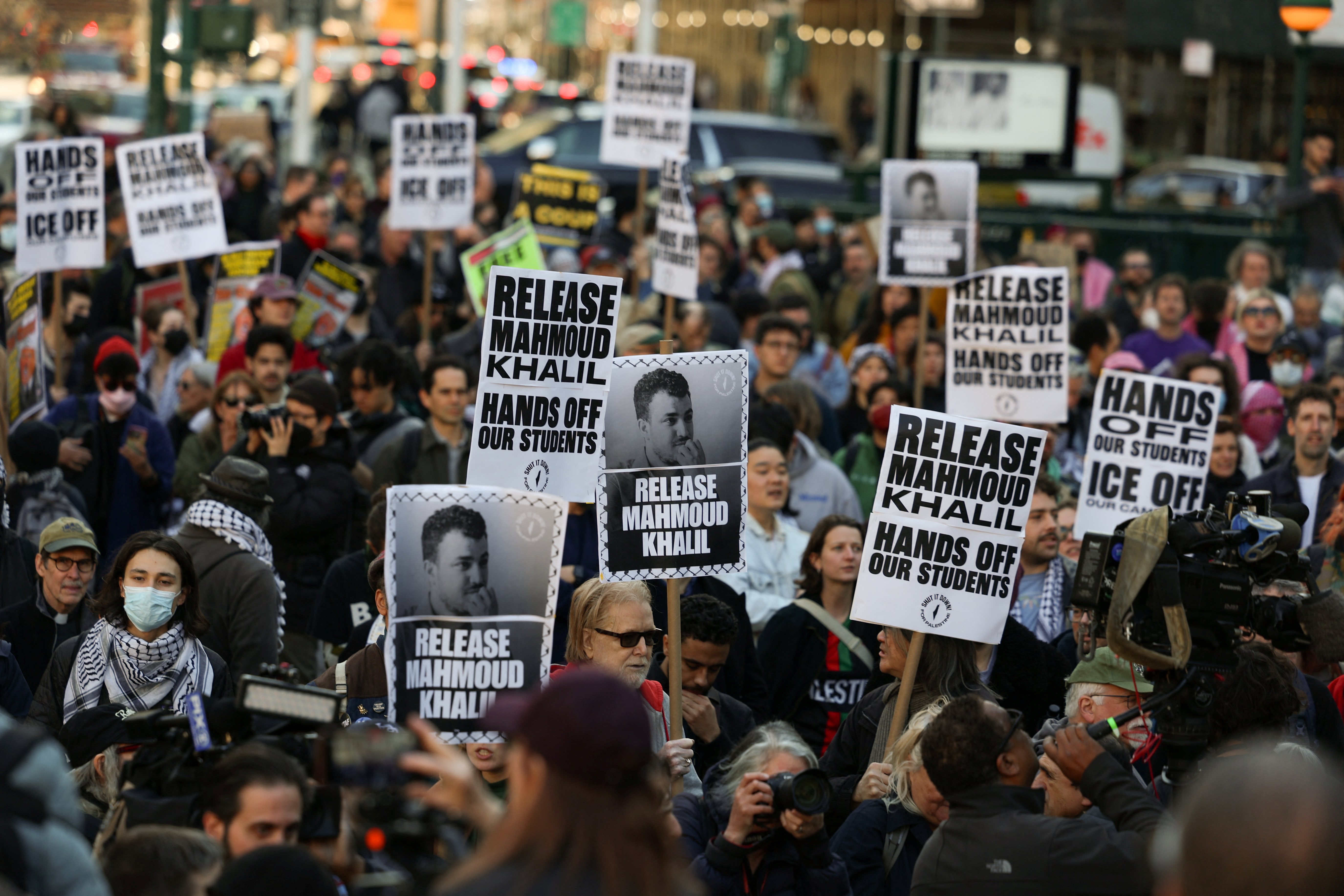Protesters hold up signs calling for Mahmoud Khalil's release