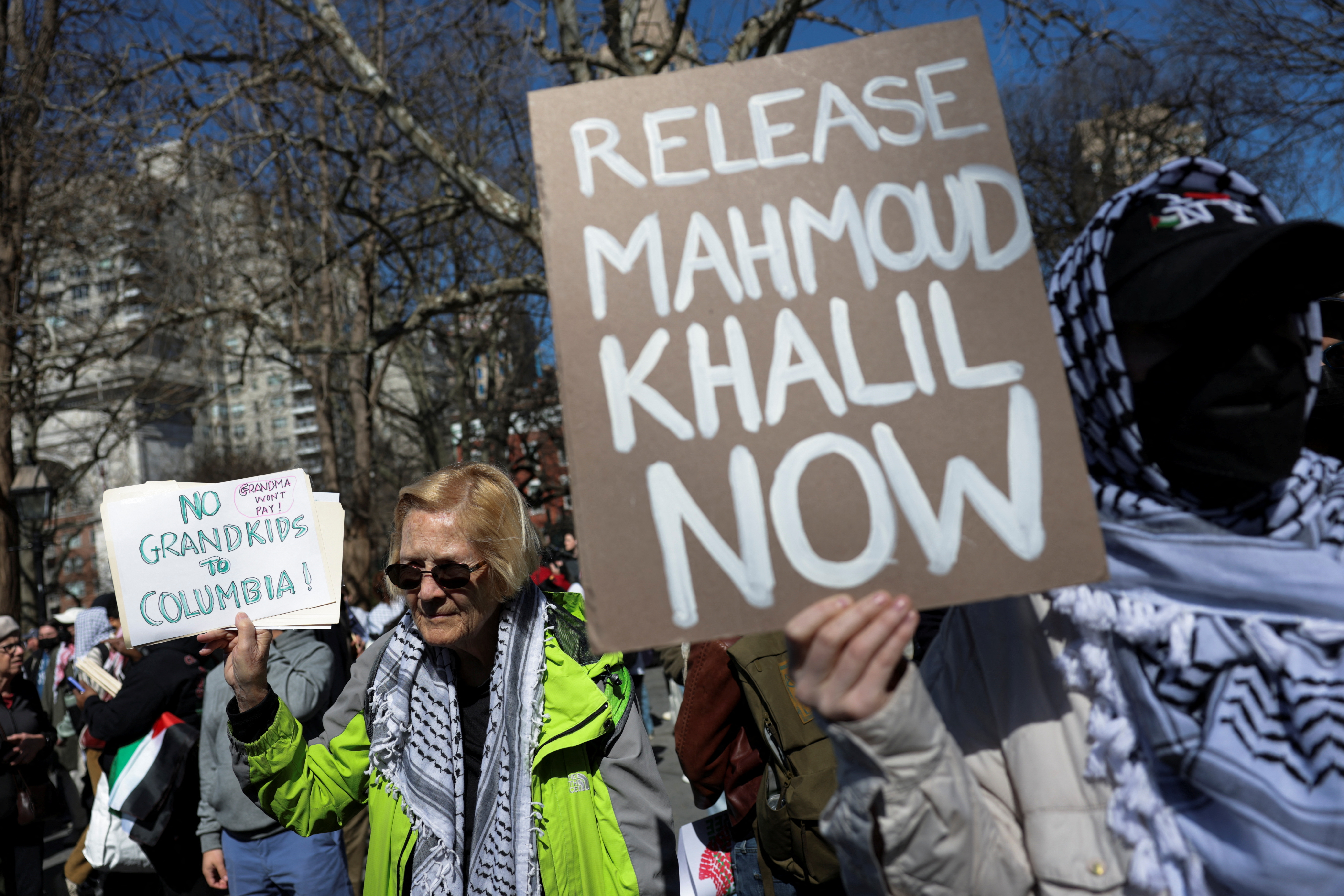 Protester holds sign that reads, release Mahmoud now