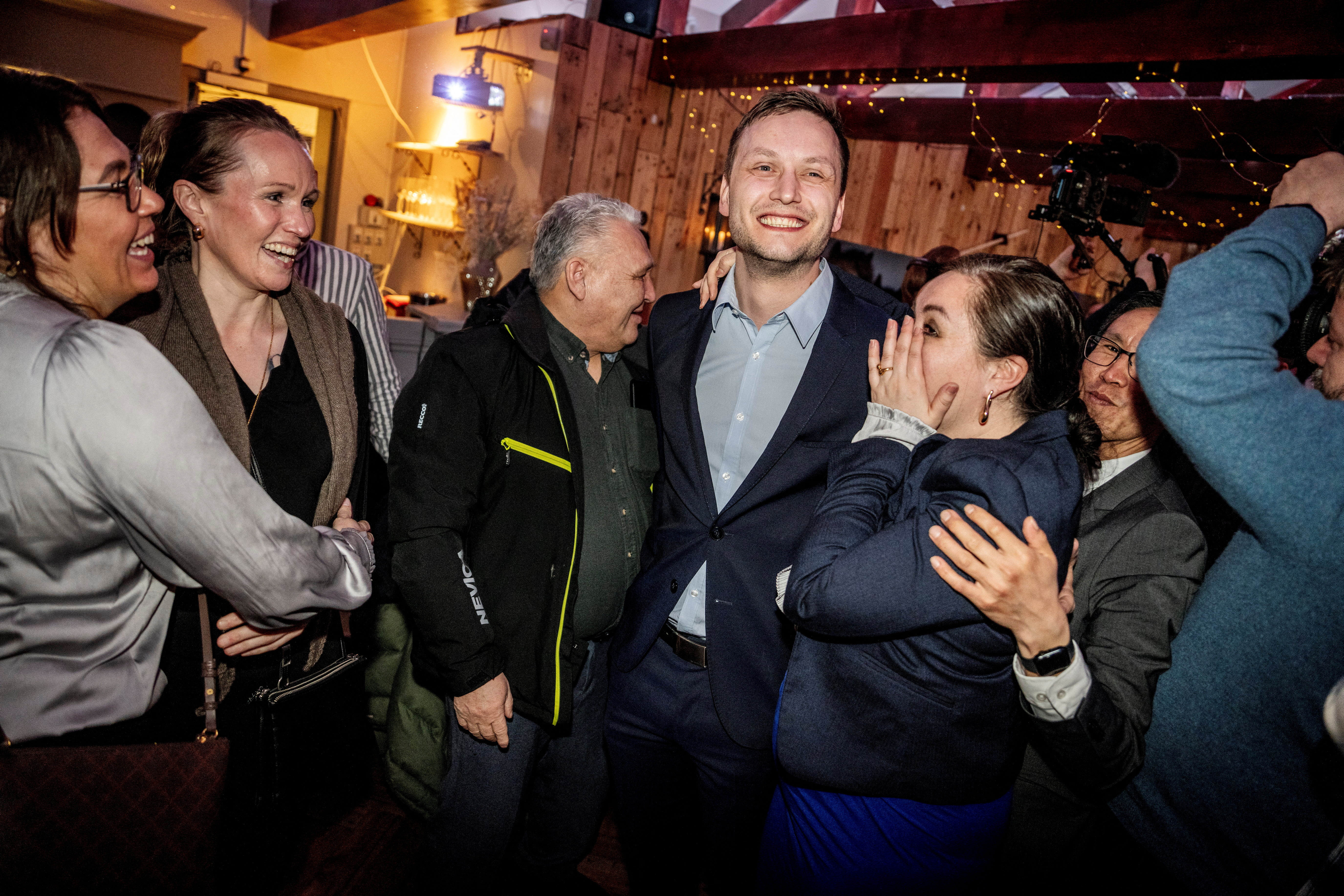 Leader of Demokraatit, Jens-Frederik Nielsen, reacts during the election party at cafe Killut in Nuuk, March 12, 2025. Ritzau Scanpix/Mads Claus Rasmussen via REUTERS ATTENTION EDITORS - THIS IMAGE WAS PROVIDED BY A THIRD PARTY. DENMARK OUT. NO COMMERCIAL OR EDITORIAL SALES IN DENMARK.