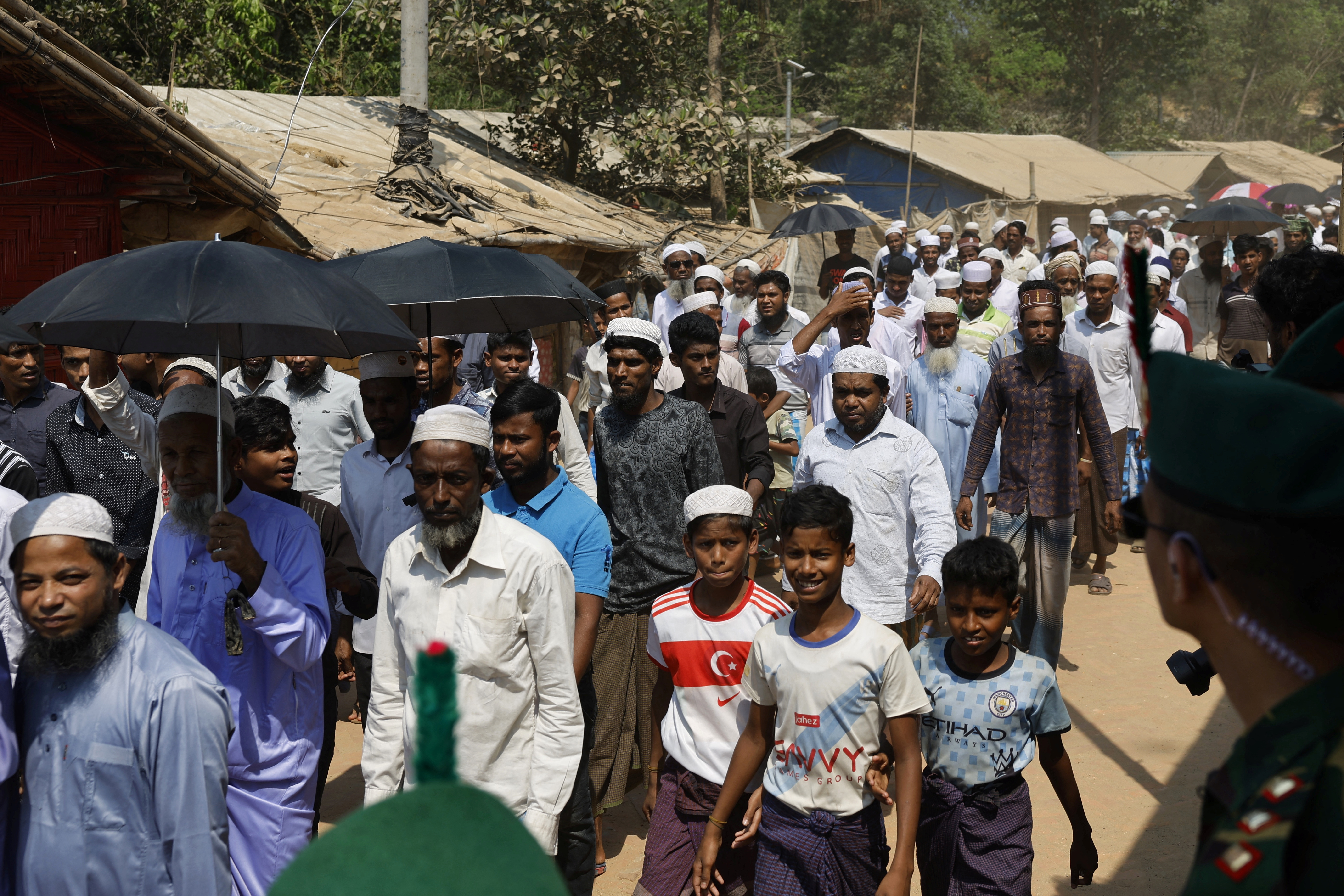 Rohingya refugees walk towards the venue where they will have an Iftar meal in the evening with UN Secretary-General Antonio Guterres and Muhammad Yunus, chief adviser of the Bangladesh interim government, in Cox’s Bazar, Bangladesh, March 14, 2025
