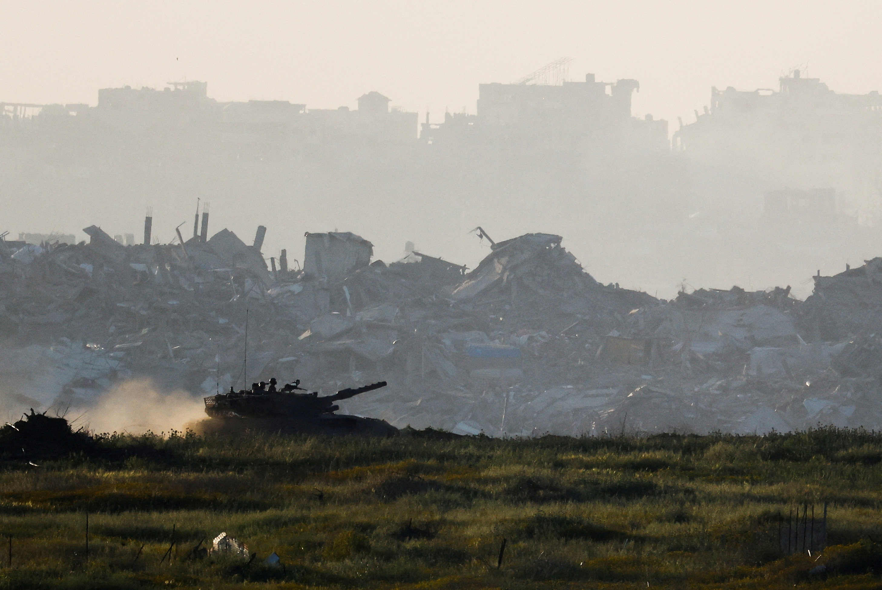 FILE PHOTO: A tank manoeuvres inside Gaza, as seen from Israel's border with Gaza, Israel March 19, 2025. REUTERS/Amir Cohen/File Photo TPX IMAGES OF THE DAY/