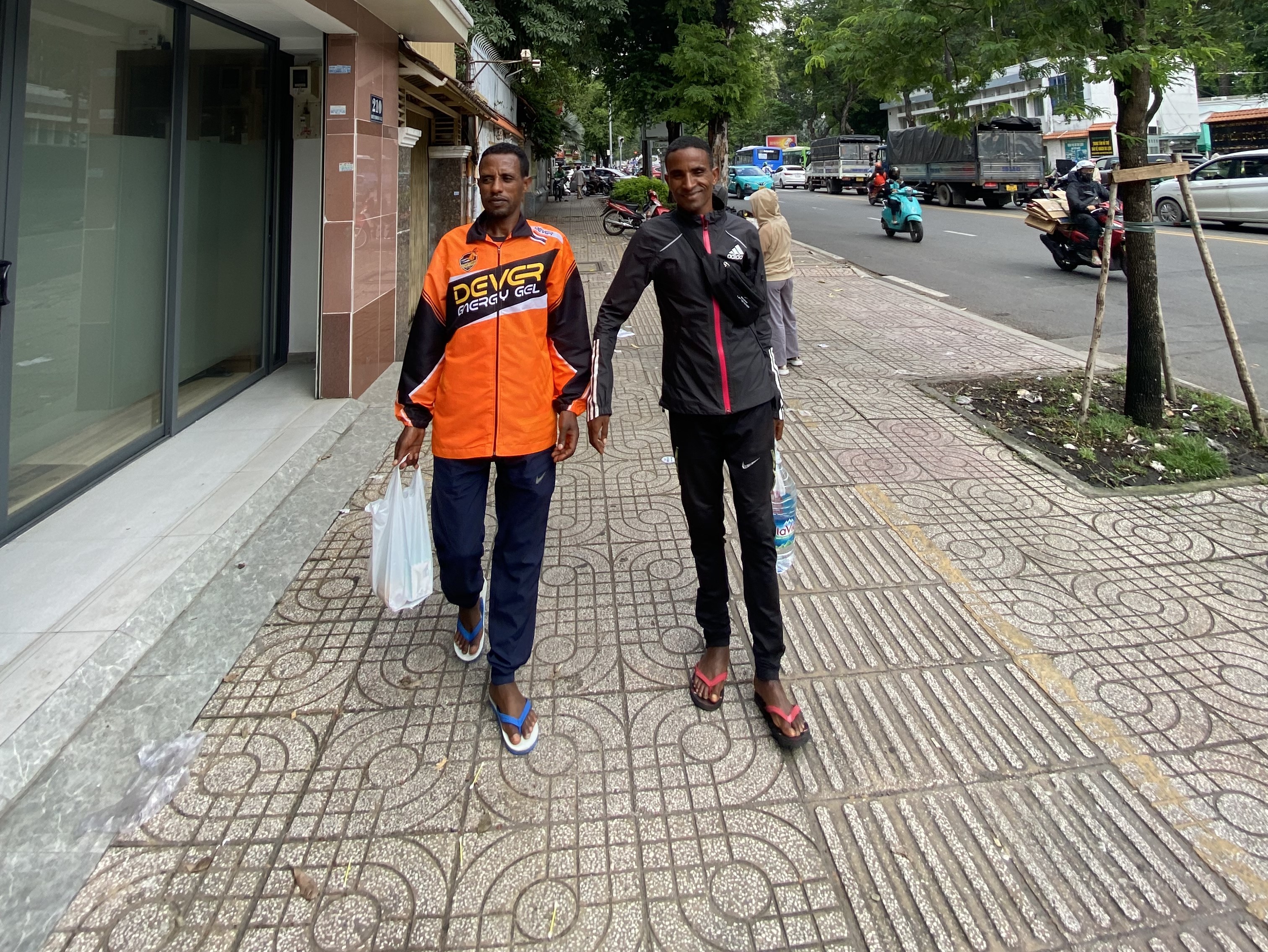 Miko and Keress shop for groceries in Ho Chi Minh City, Vietnam [Danh Nguyen/Al Jazeera]