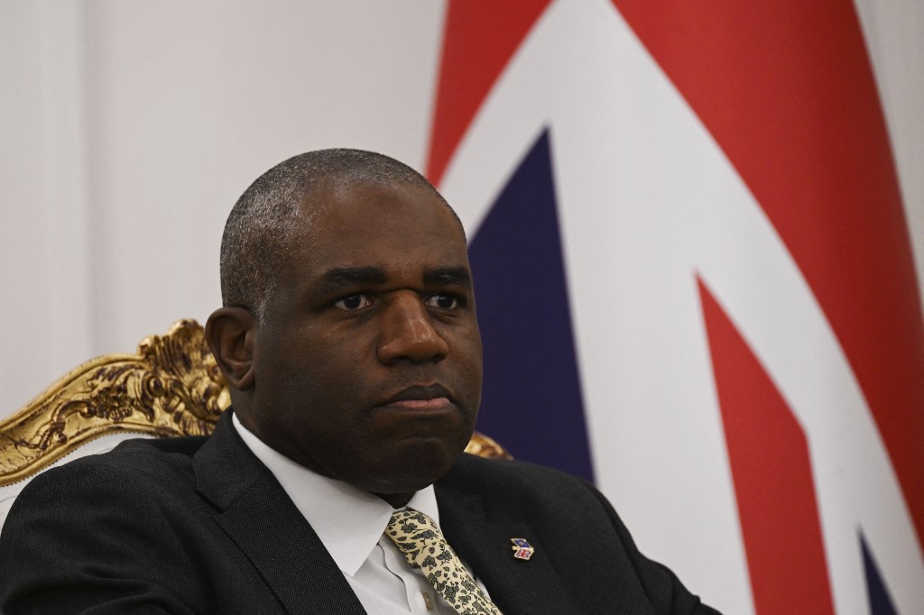 Britain's Foreign Secretary David Lammy attends a meeting with Kosovo's President Vjosa Osmani during his official visit to Kosovo, in Prishtina on April 2, 2025. (Photo by Armend NIMANI / AFP)
