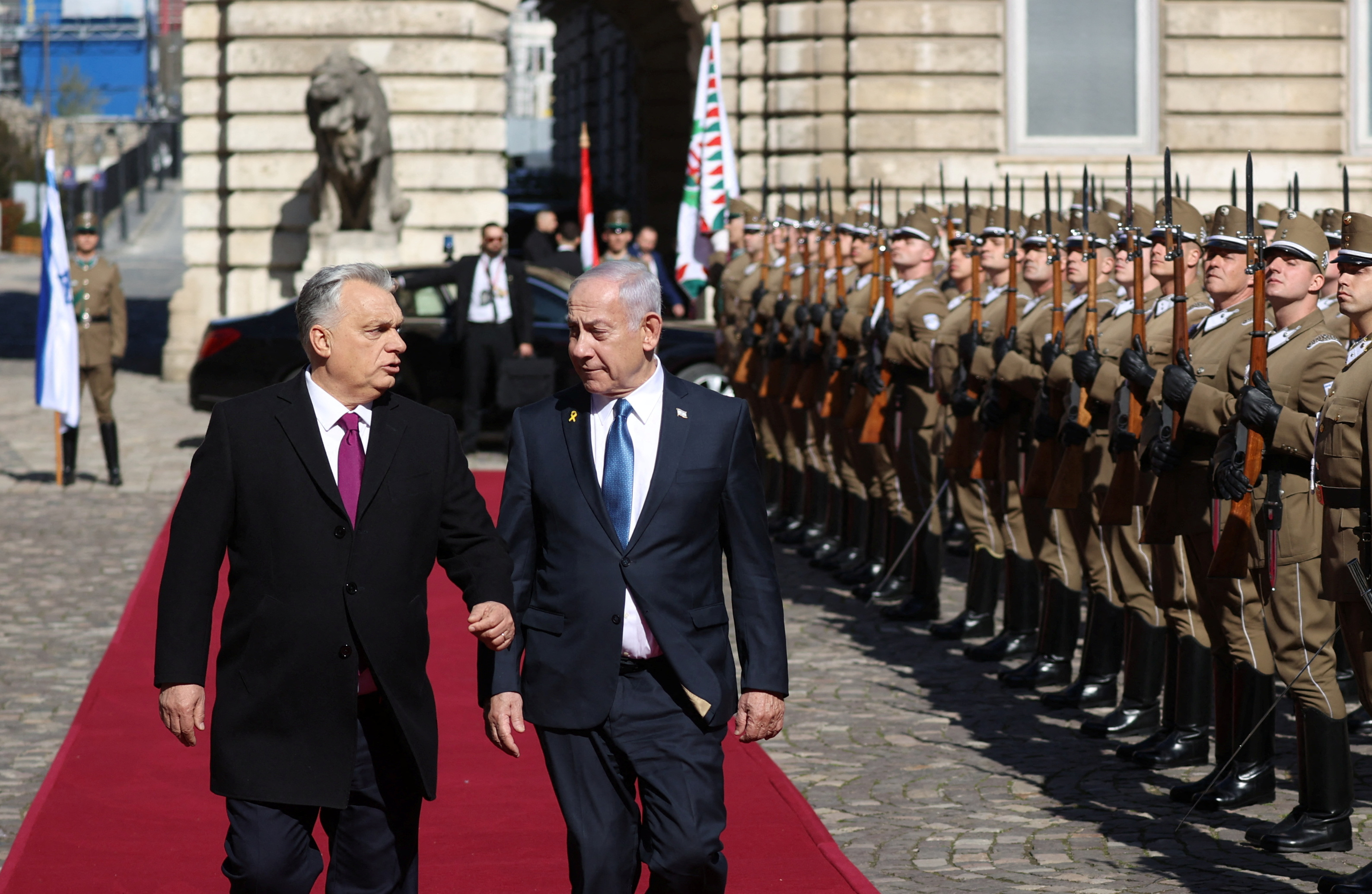 Hungarian Prime Minister Viktor Orban and Israeli Prime Minister Benjamin Netanyahu walk on the red carpet during a welcoming ceremony at the Lion's Courtyard in Budapest, Hungary, April 3, 2025. REUTERS/Bernadett Szabo
