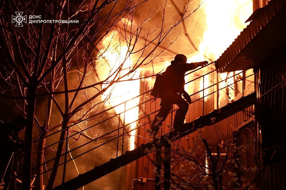 A firefighter works at the site of a Russian drone attack.
