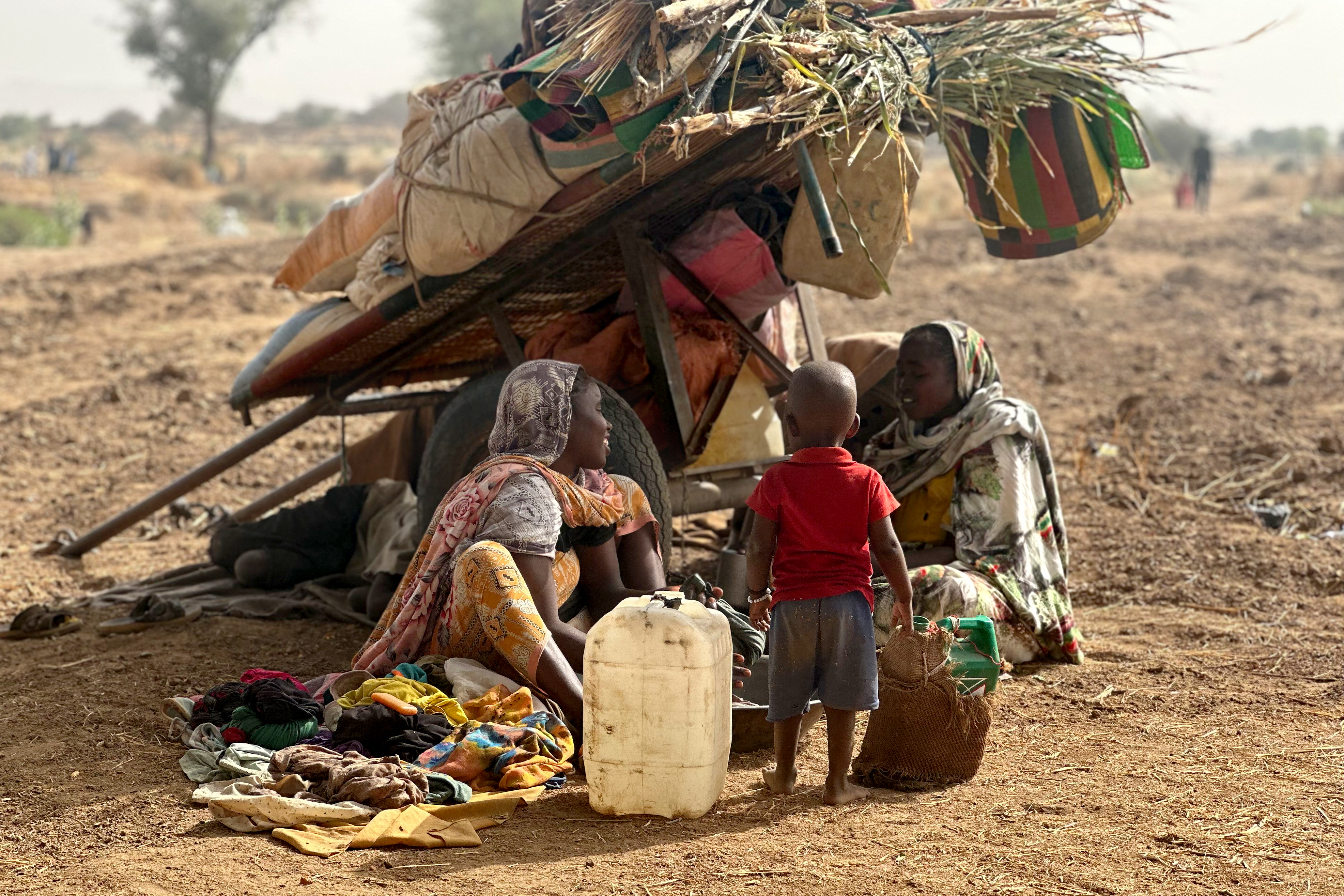 People who fled Zamzam rest in a makeshift encampment in a field near Tawila on April 13, 2025. The RSF announced that day that after two days of heavy shelling, it had taken the famine-hit camp, home to more than 500,000 people, according to the UN [AFP]