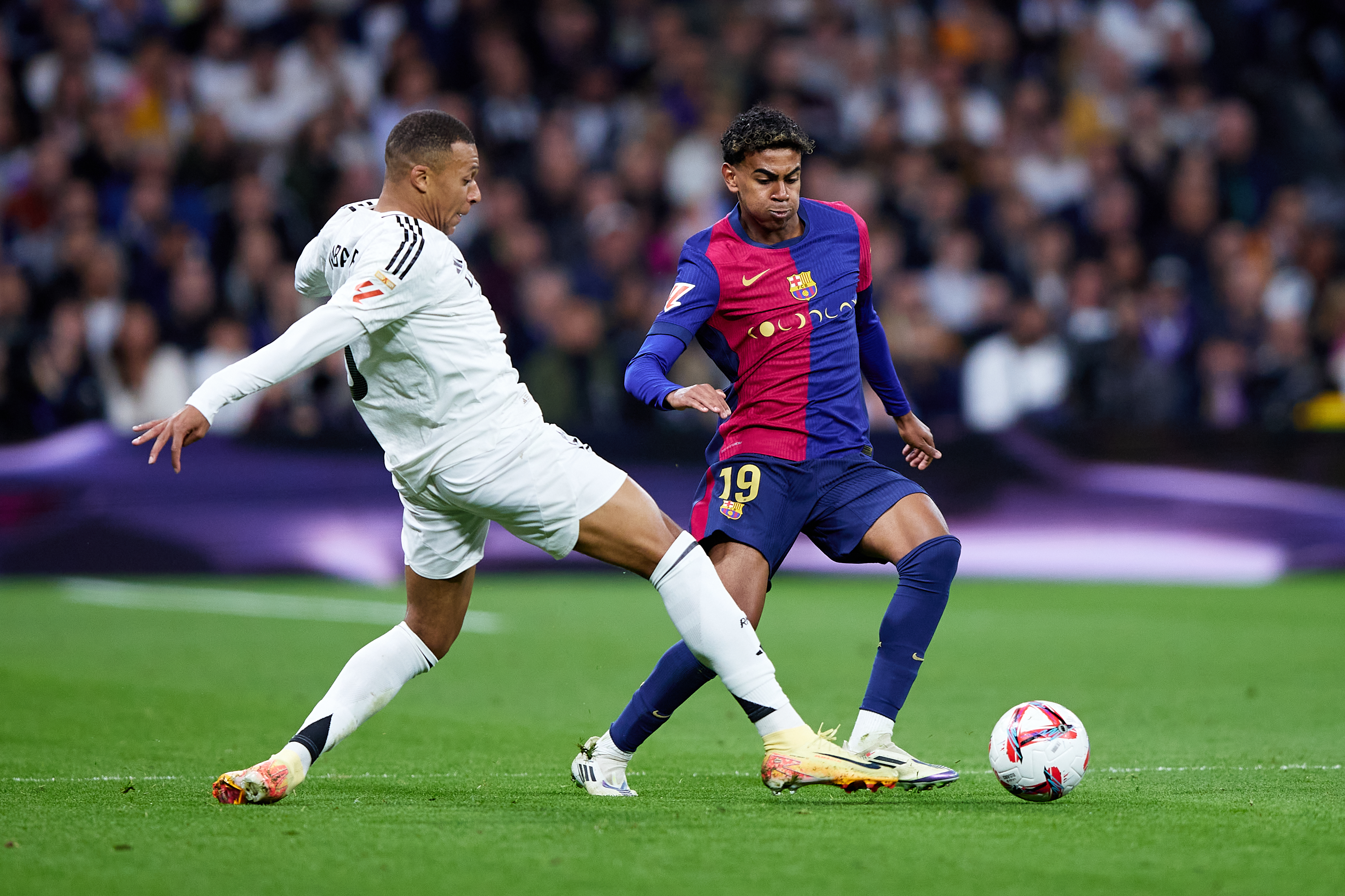 Kylian Mbappe and Lamine Yamal in action.