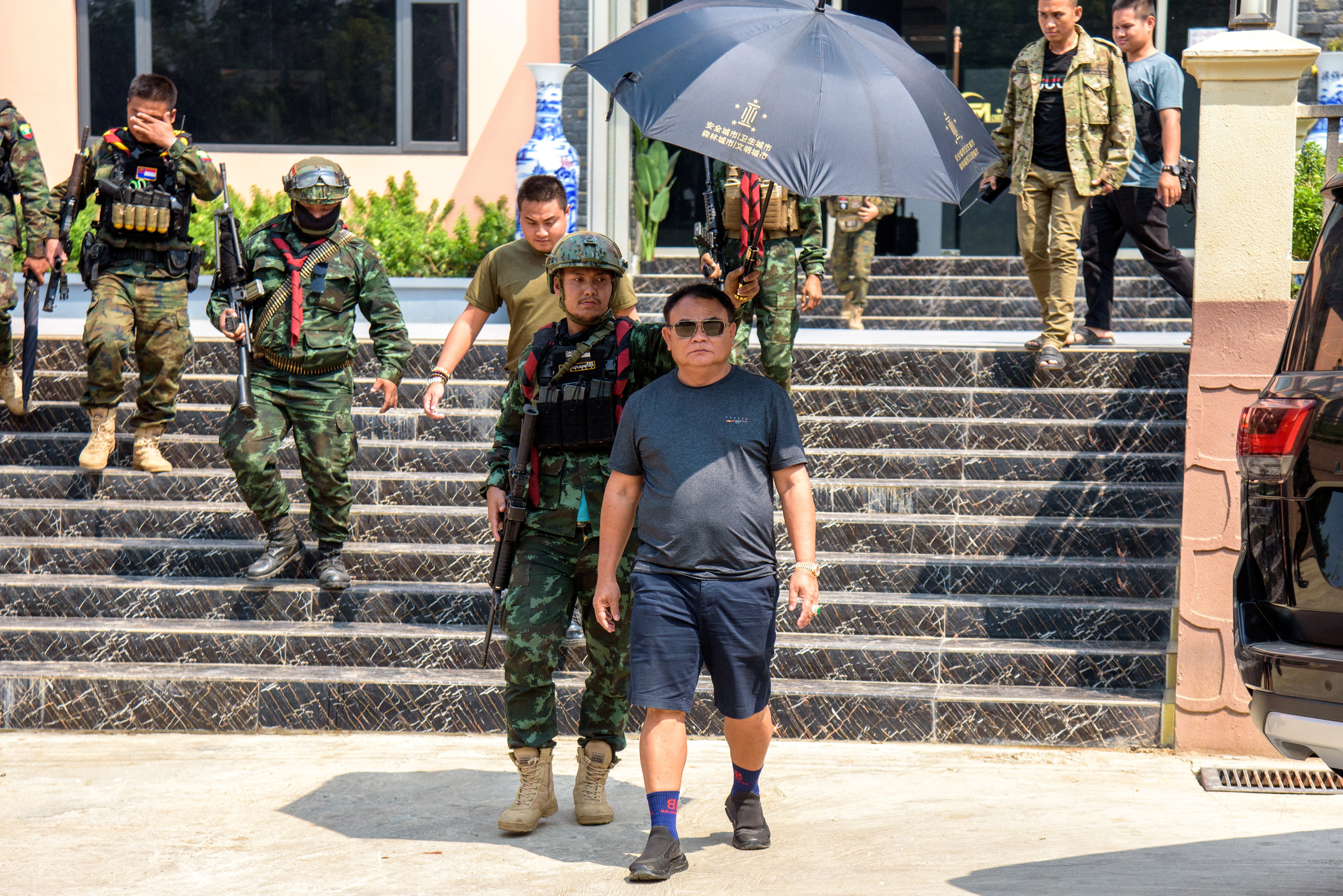 Myanmar warlord Saw Chit Thu leaves after an interview with local media at Shwe Kokko city, a casino, entertainment and tourism complex in Myawaddy, Myanmar, February 18, 2025. REUTERS/Stringer