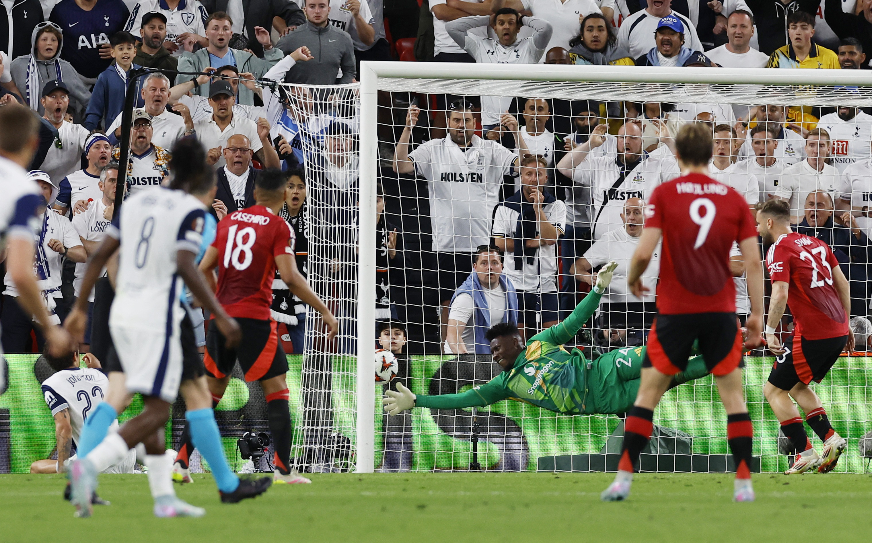 Tottenham Hotspur’s Brennan Johnson, left, scores their first goal