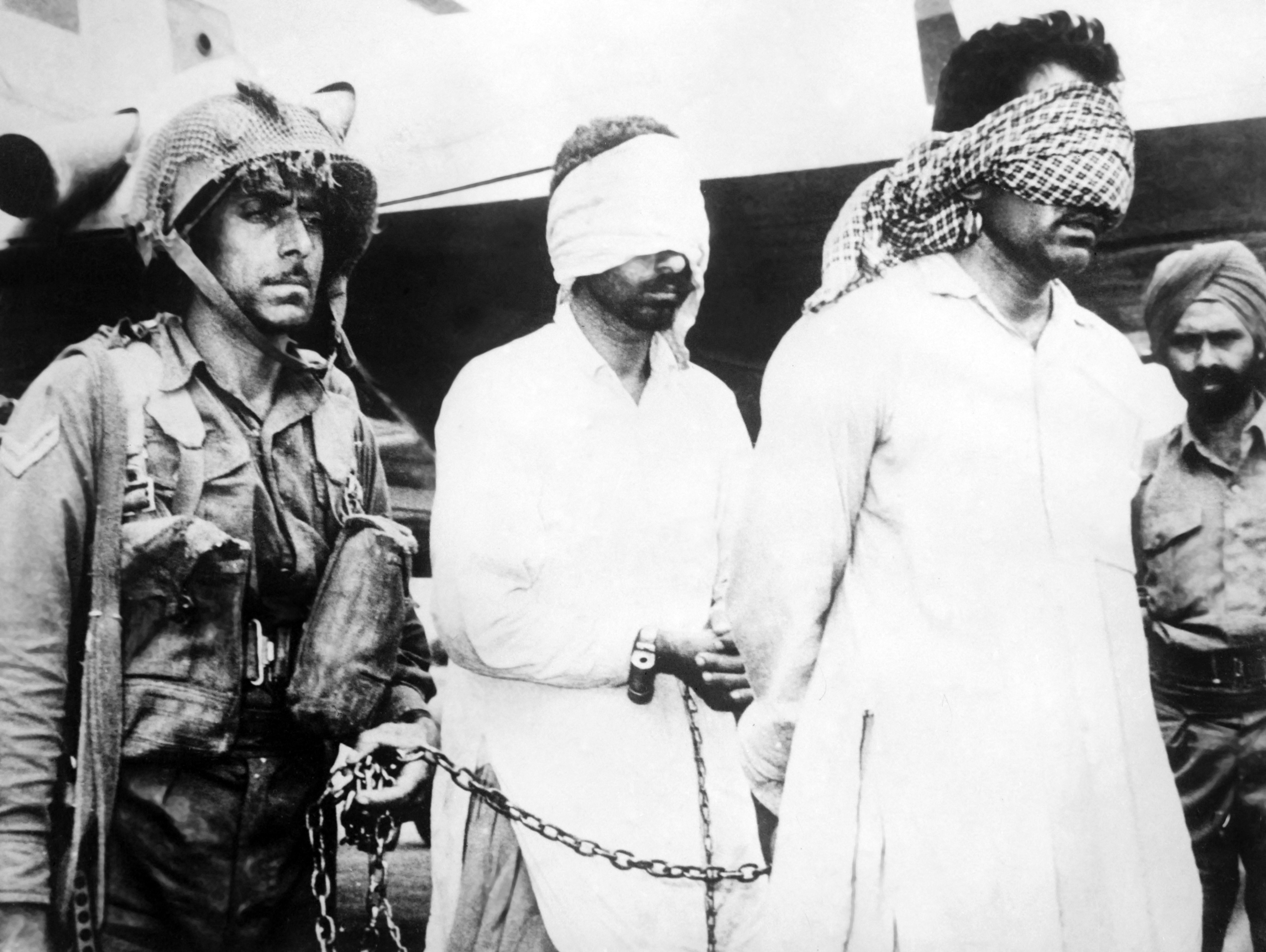 A picture taken on August 12, 1965 in New Delhi shows two Pakistani officers captured during the Second Indo-Pakistani War, known as the Second Kashmir War