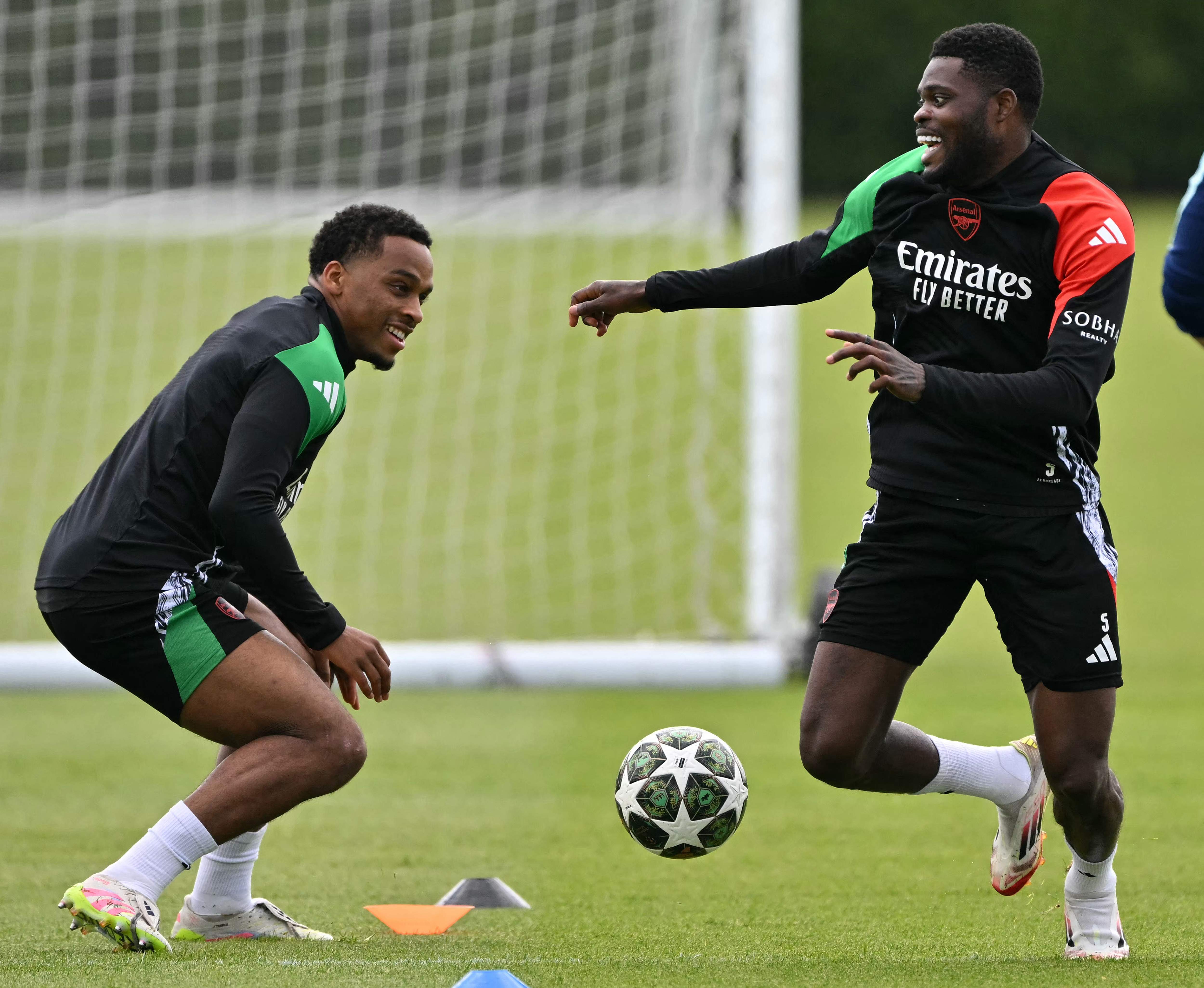 Arsenal’s Dutch defender #12 Jurrien Timber, left, and Ghanaian midfielder #5 Thomas Partey take part in a team training session in London Colney, north of London, on May 6, 2025, on the eve of their UEFA Champions League semifinal second leg match against PSG