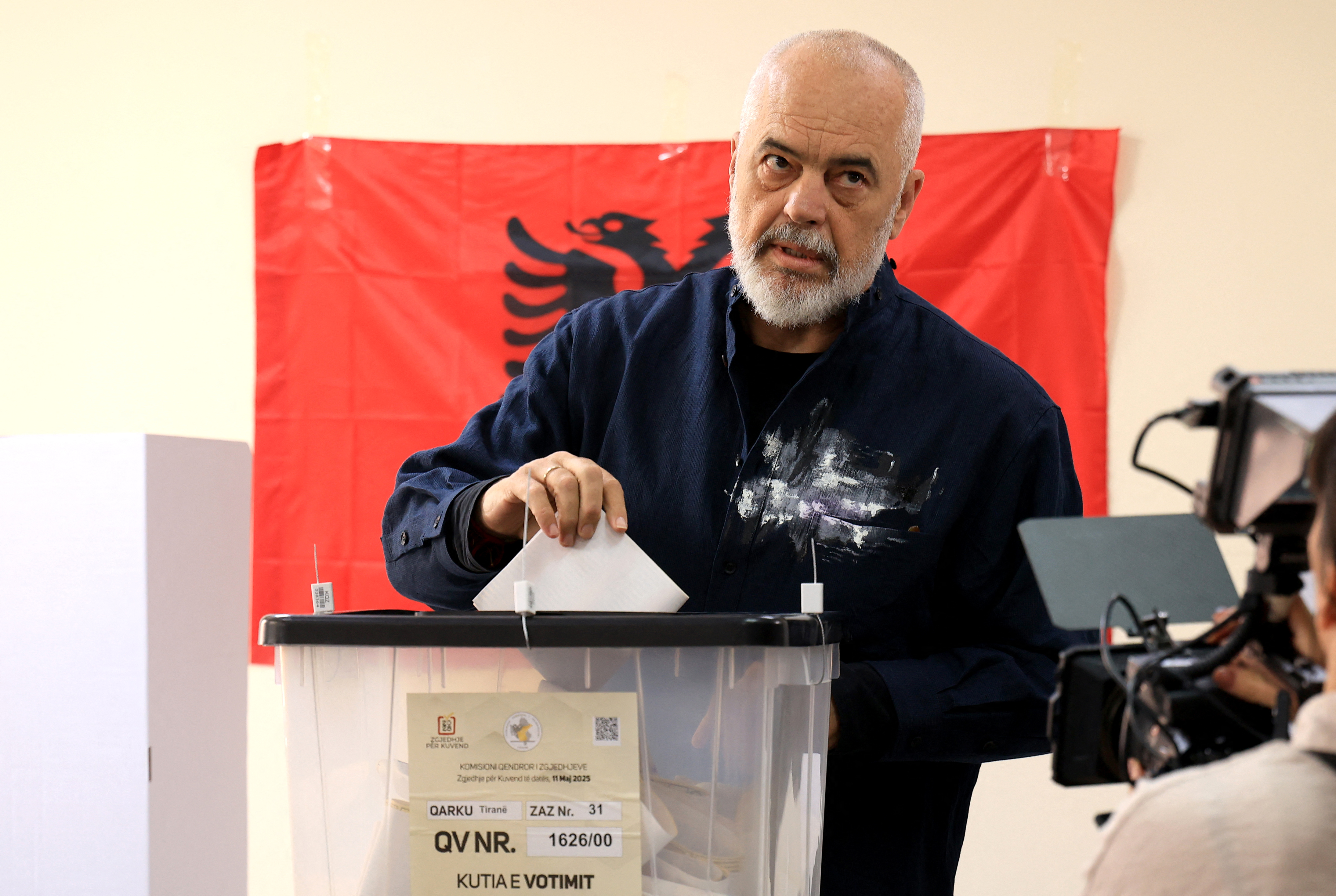 Albanian Prime Minister Edi Rama casts his vote at a voting station in Tirana