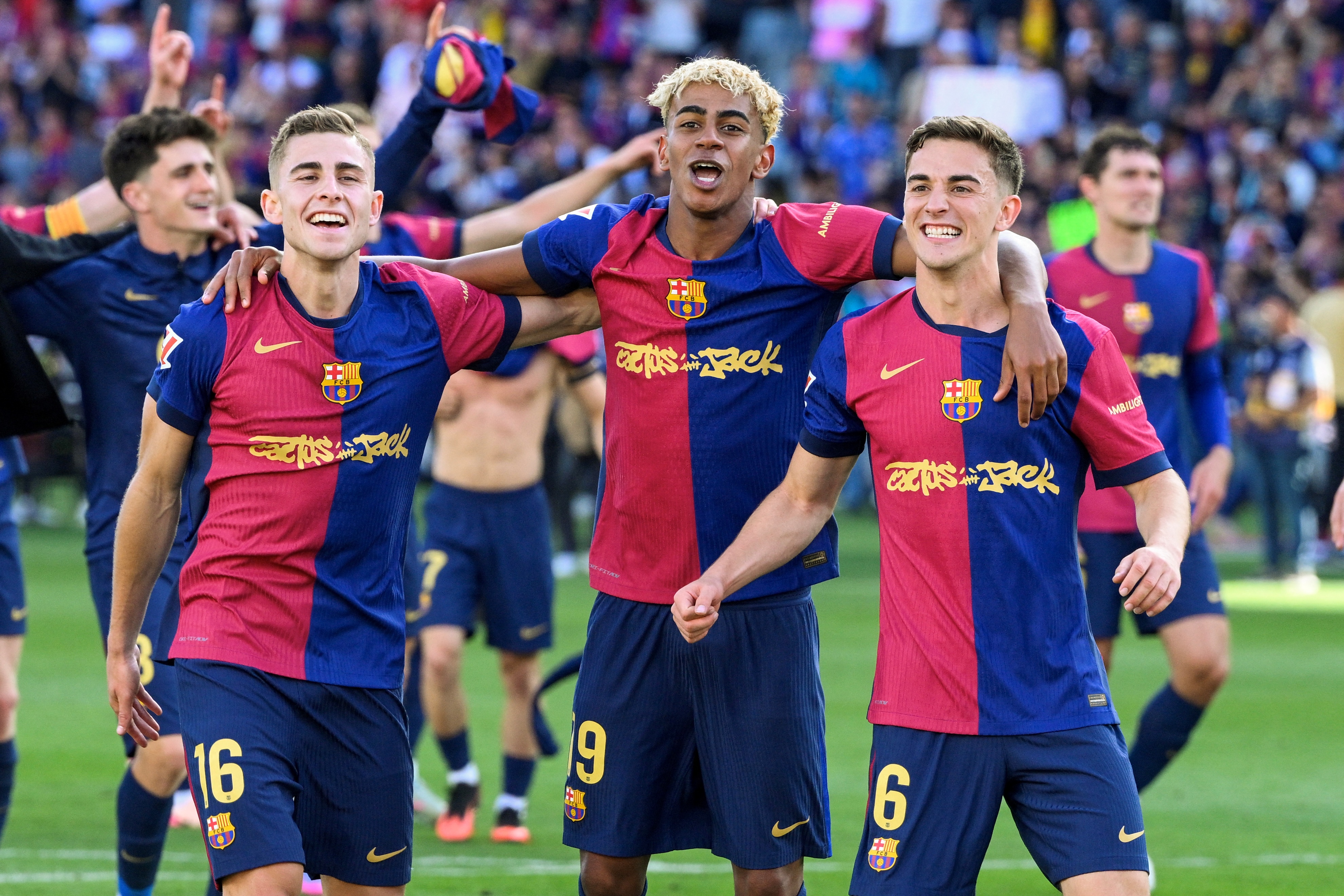 (From L) Barcelona's Spanish midfielder #16 Fermin Lopez, Barcelona's Spanish forward #19 Lamine Yamal and Barcelona's Spanish midfielder #06 Pablo Gavi celebrate victory at the end of the Spanish league football match between FC Barcelona and Real Madrid CF at Estadi Olimpic Lluis Companys in Barcelona, on May 11, 2025. Barcelona won 4-3. (Photo by Josep LAGO / AFP)