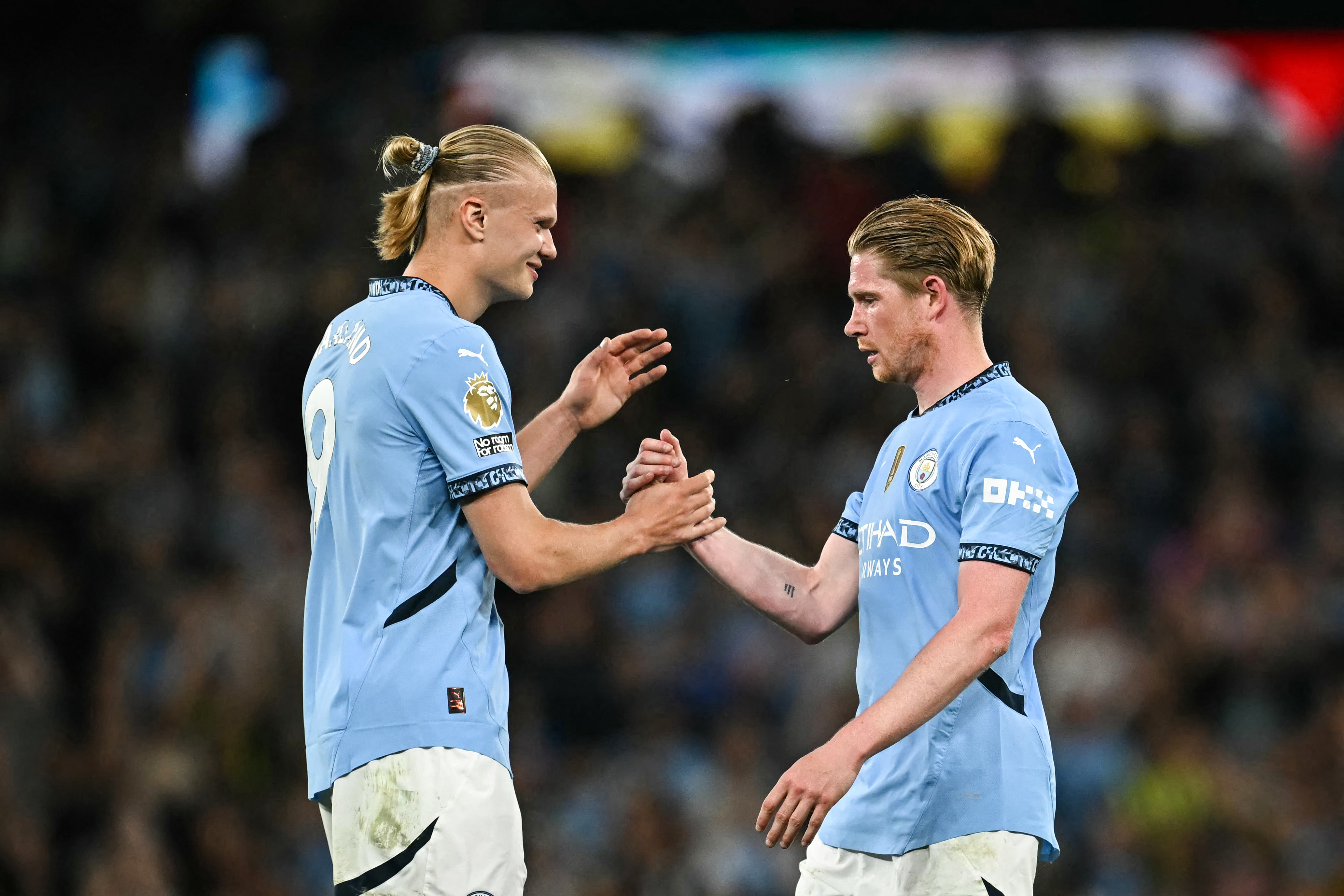 De Bruyne, right, shakes hands with Man City teammate Erling Haaland after the match