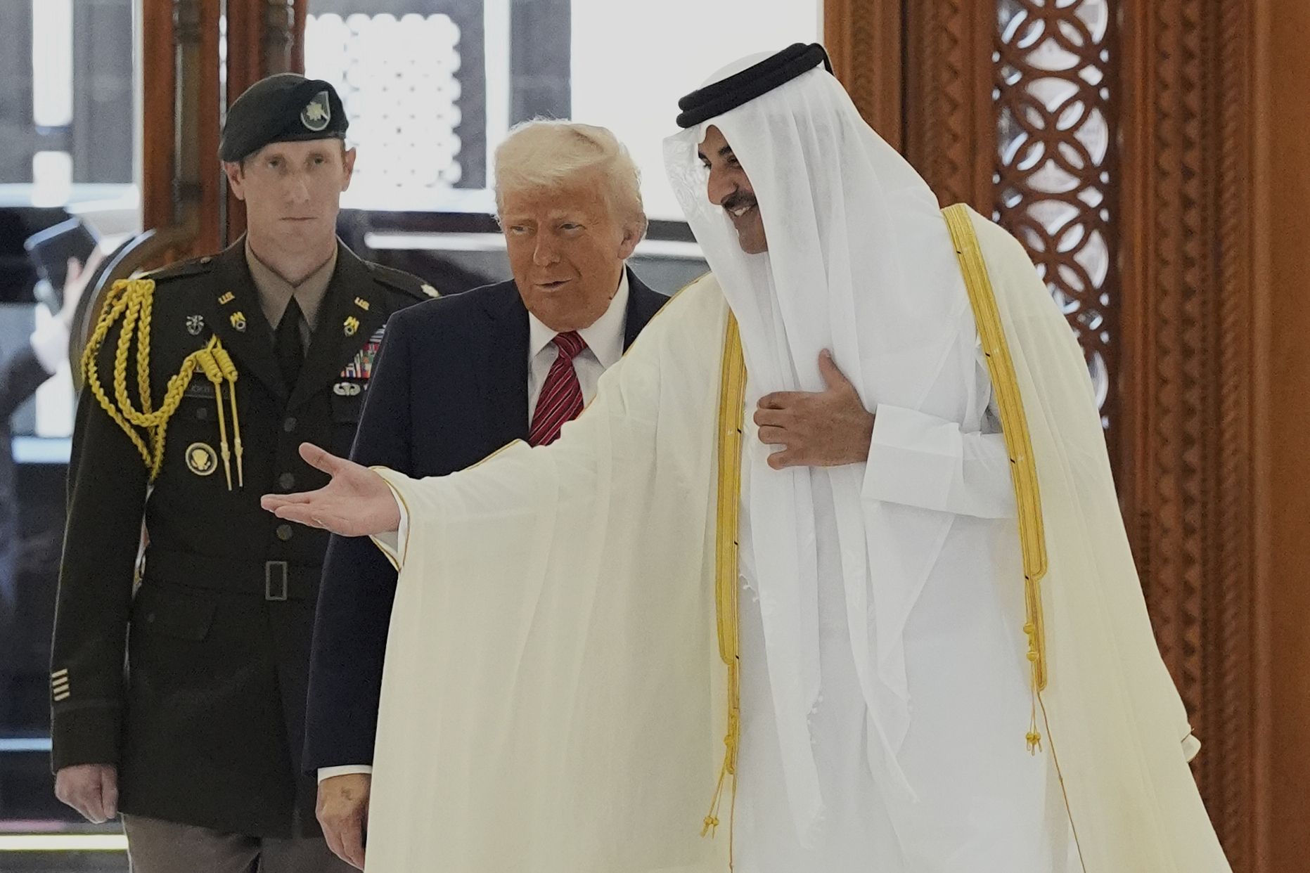 Qatar’s Emir Sheikh Tamim bin Hamad Al Thani welcomes President Donald Trump during an official welcoming ceremony on May 14