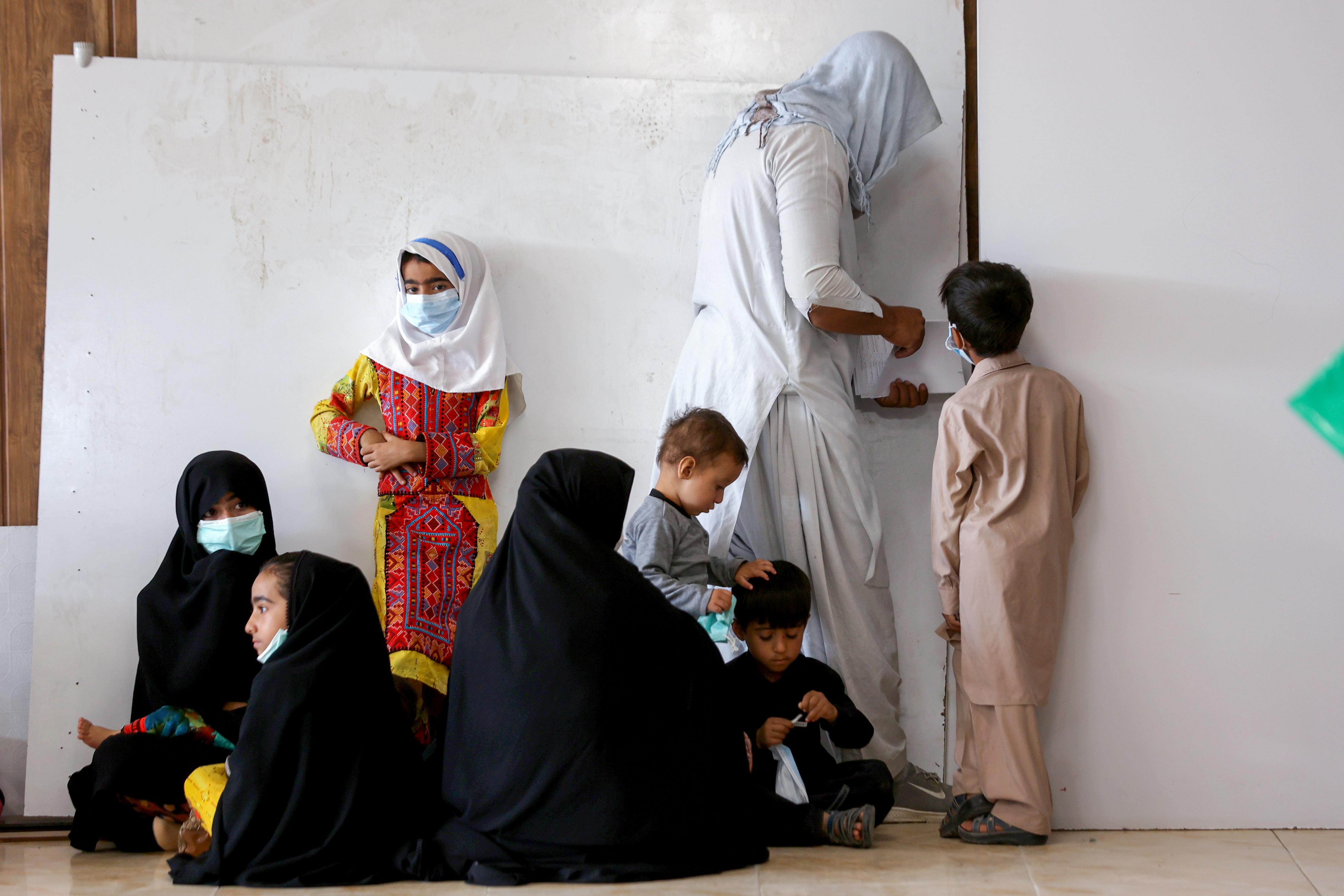 Afghan nationals wait at an Afghan refugee camp in Zahedan, Iran, following the return of the Taliban to power in Afghanistan, on September 8, 2021