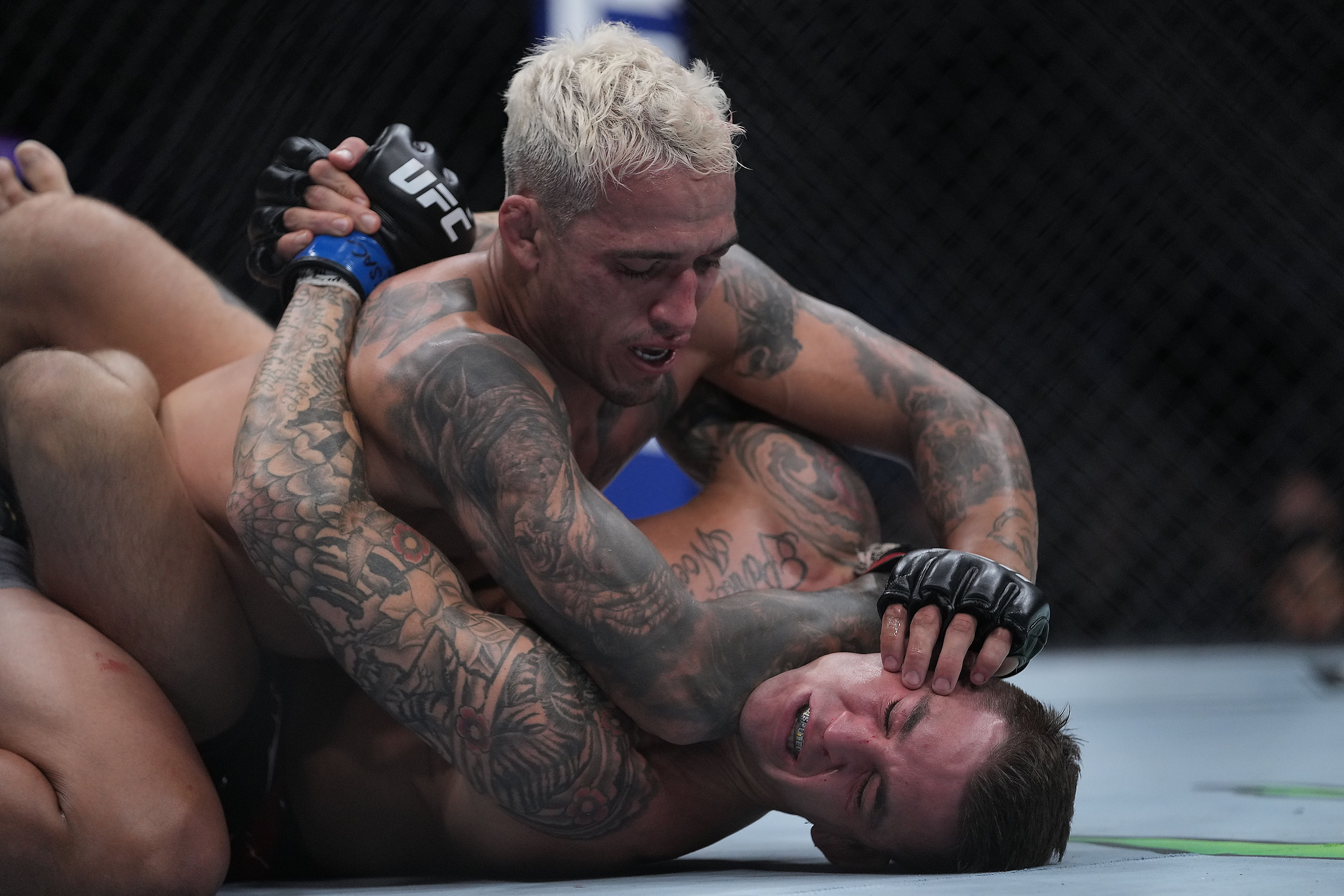 Charles Oliveira’s, top, ground game is one of the best in UFC