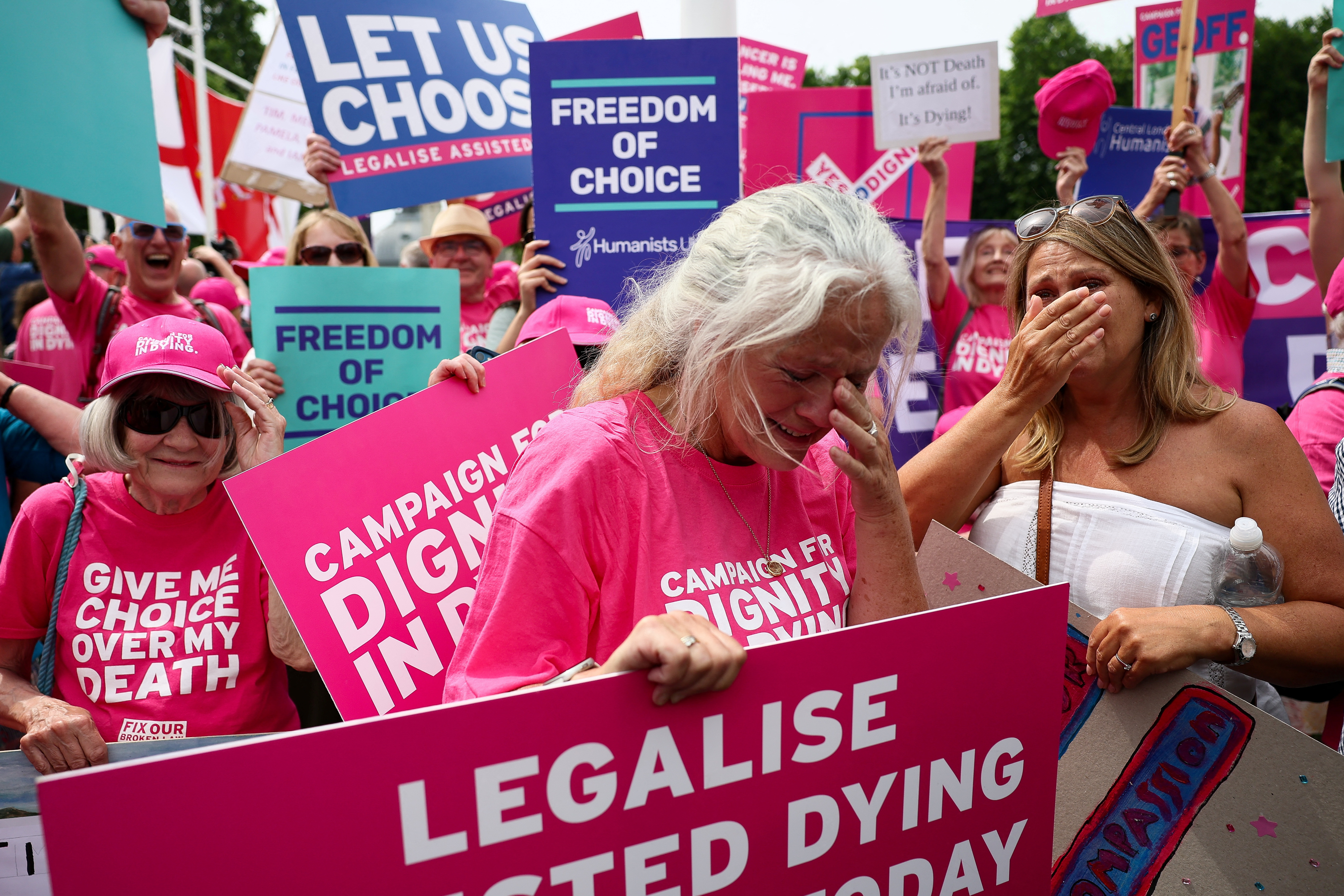 Protesters react after the UK Parliament votes in favour of a bill to legalise assisted dying in London on June 20, 2025