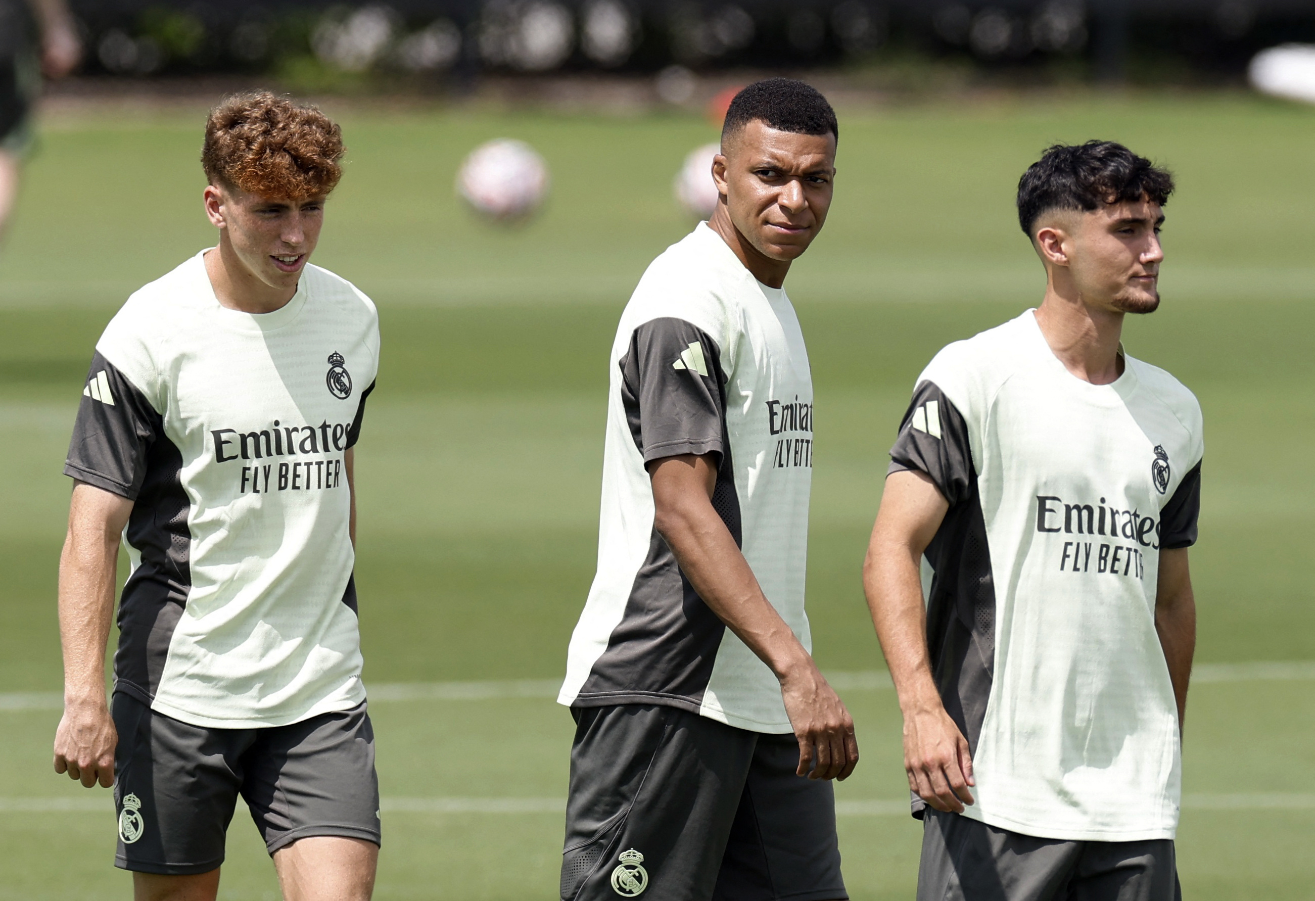 Soccer Football - FIFA Club World Cup - Real Madrid Training - Gardens North Country District Park, Palm Beach Gardens, Florida, U.S. - June 25, 2025 Real Madrid's Kylian Mbappe, Victor Munoz and Raul Asencio during training REUTERS/Marco Bello