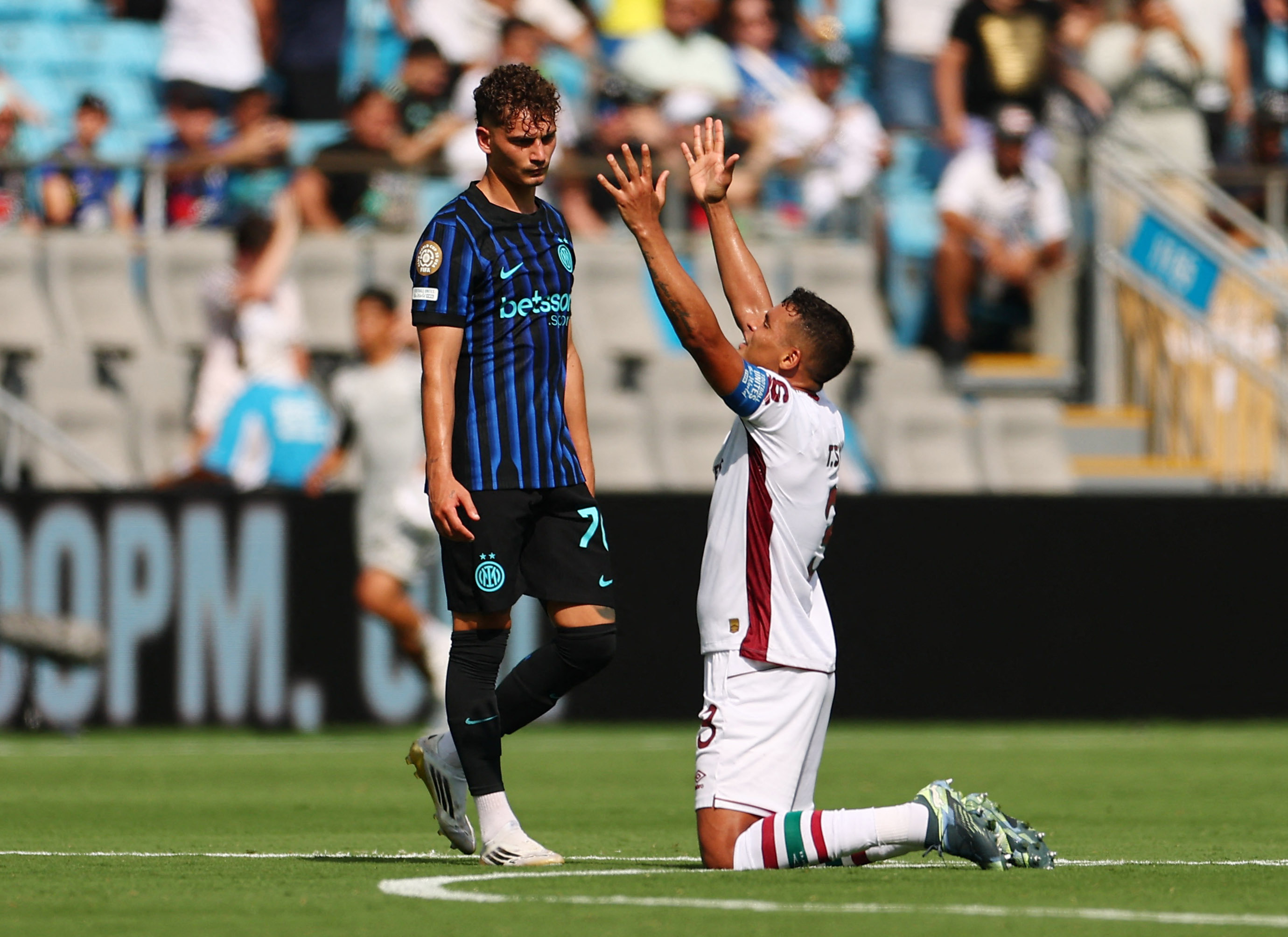 Thiago Silva sinks to his knees and holds his arms aloft